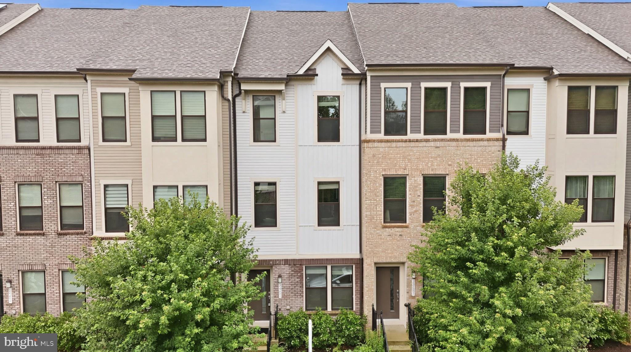 Welcome to 3221 Watershed Boulevard, a beautifully appointed three-level townhome nestled in the sought-after Watershed community, where refined interiors, thoughtful upgrades, and resort-style amenities converge to create an exceptional lifestyle opportunity. From the moment you arrive, the home makes a striking first impression with its handsome brick water table, attractive vinyl and Hardie Plank-style exterior accents, elegant black iron railings, exterior lighting, private one-car driveway, and one-car garage, all set just moments from a charming community green space designed for gathering, games, fireside evenings, and outdoor enjoyment. Inside, sun-drenched living spaces unfold across a meticulously maintained interior enhanced by fresh paint, brand-new carpet, and luxury vinyl plank flooring. The welcoming foyer opens to a versatile entry-level bedroom complete with ceiling fan, window treatments, and access to a beautifully finished full bath featuring ceramic tile, tub/shower surround, cultured marble vanity, and convenient garage access—ideal for guests, multigenerational living, or a private office suite. Ascend to the main living level where the heart of the home reveals itself in a stunning gourmet kitchen designed for both daily living and entertaining, showcasing quartz countertops, 42-inch gray cabinetry with crown molding, convenient pull-out storage, stainless steel appliances, a gas range, vented microwave, upgraded refrigerator, oversized stainless sink with deep bins, and a massive pantry. Just beyond, the dining area opens to a Trex deck overlooking the beautifully maintained community space, creating the perfect backdrop for morning coffee or evening unwinding, while the spacious family room is framed by large windows, window treatments, and a ceiling fan for effortless comfort. The upper level offers a tranquil retreat, highlighted by an impressive owner’s suite with fresh paint, brand-new carpet, generous walk-in closet space, and a spa-inspired en-suite bath with quartz double vanity, ceramic tile, and an oversized walk-in shower. An additional upper-level bedroom enjoys its own attached full bath with ceramic tile, tub/shower combination, stylish vanity, and natural light, delivering comfort and privacy for family or guests alike. Modern convenience is woven throughout with an Ecobee smart thermostat, Ethernet pre-wiring and outlets in every bedroom and living room, Bluetooth garage door opener, and a Samsung washer and dryer replaced in 2023, while major systems including the roof, HVAC, and water heater were all replaced in 2020 for added peace of mind. All of this is set within the amenity-rich Watershed community, where residents enjoy access to pools, fitness centers, community clubhouses, multiple playgrounds, scenic walking trails, community vegetable gardens, and inviting open spaces, all just moments from shopping, dining, major commuter routes, NSA, Fort Meade, and BWI. This is low-maintenance luxury living in one of the area’s most vibrant and connected communities.