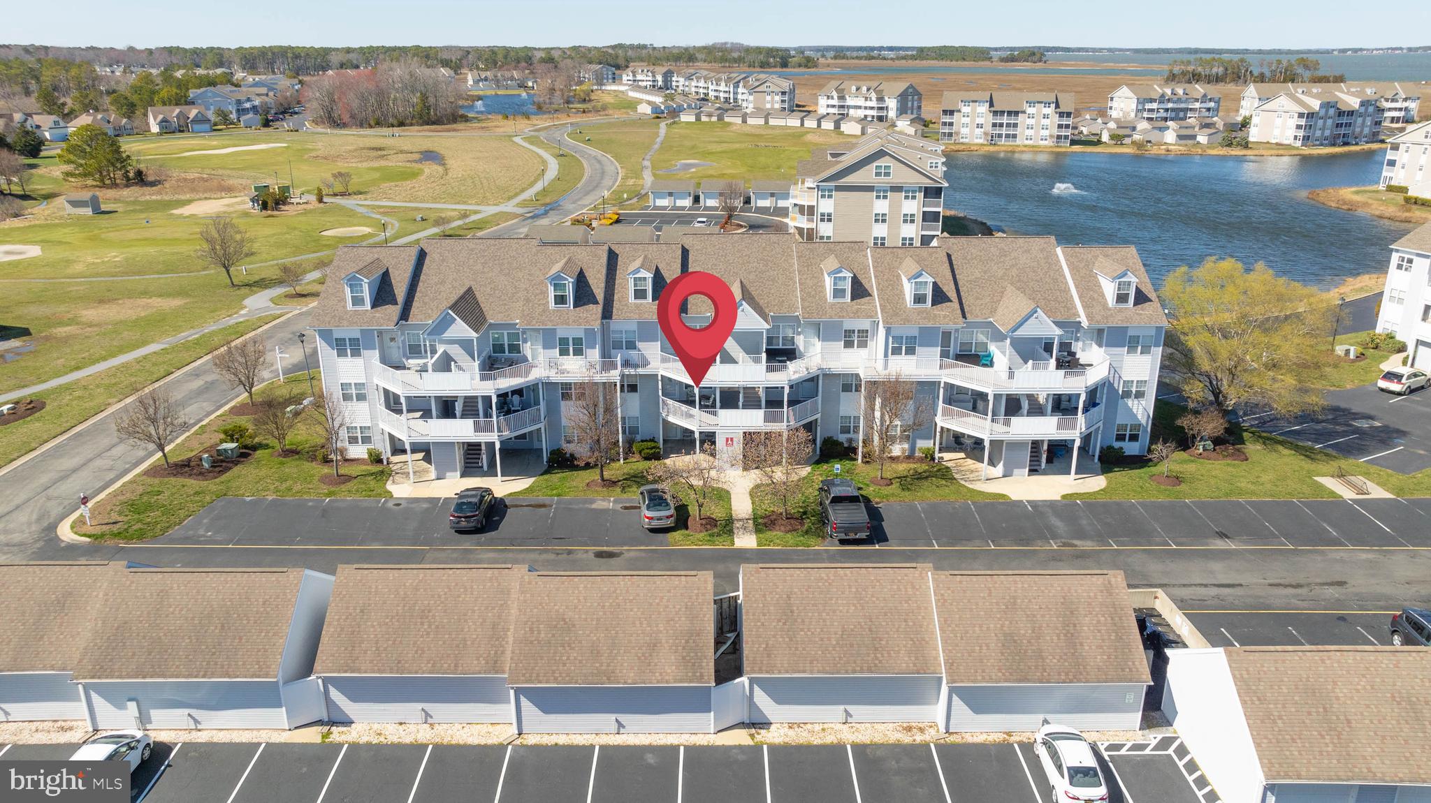Welcome to this charming 2-bedroom, 2-bathroom condo nestled in the highly sought-after, AMENITY-RICH community of Bethany Bay in Ocean View, Delaware. Just minutes from the sandy shores of Bethany Beach, tax-free shopping, renowned restaurants, and endless outdoor activities, this home offers the perfect blend of relaxation and convenience. Step inside to an OPEN-CONCEPT living, dining, and kitchen space, perfect for entertaining or unwinding after a day at the beach. The eat-in kitchen features modern cabinetry and a pass-through window, creating a seamless flow into the cozy living area. Glass sliders lead to a bright and airy balcony, where you can sip your morning coffee while taking in SERENE VIEWS. Best of all, enjoy RESORT-STYLE LIVING with a community pool, tennis and pickleball courts, a 9-hole par-3 golf course, a modern fitness center, scenic walking and biking trails, a fishing pier, a kayak launch, and a boat ramp—all just steps from your door! The HOA ensures the community's beautifully maintained landscaping and hassle-free living. Schedule your tour today!