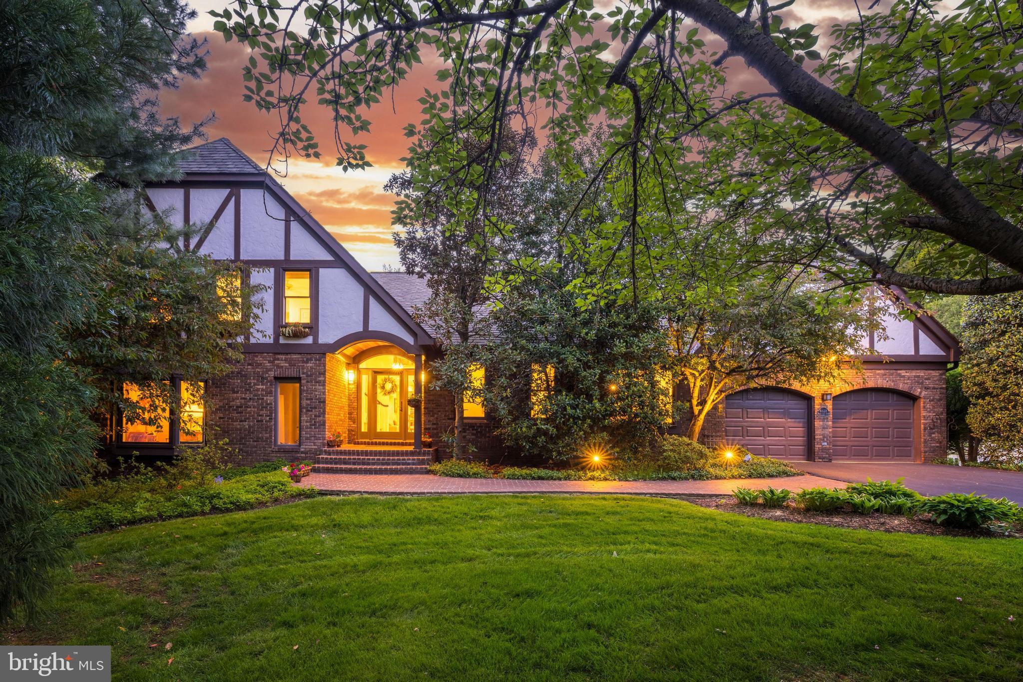 An oasis just minutes from Tysons! This exceptional custom colonial with 6100 sf of living space is privately located on a cul de sac on a spectacular lot surrounded by lush landscaping and backing to parkland.  The original house was thoughtfully expanded with large windows added across the back to bring the outdoors inside and for the owner to enjoy the glorious views from all rooms in the house.  Everywhere you look there is beauty. The main level floor plan is ideal entertaining and has great flow from indoors to outdoors. The vaulted entry was added to complement the Tudor style and takes you into the airy open foyer. The family room, kitchen and great room with walls of windows provide sweeping views of the backyard. The great room/library is an architectural masterpiece that features rich mahogany millwork, floor to ceiling windows, a cathedral ceiling, a bar with sink and a wall of built in bookshelves. The family room was redesigned with a limestone fireplace flanked by custom designed built-ins for a more modern look. The renovated kitchen with a large picture window is a chef's dream with custom cabinetry, Viking stainless steel appliances, separate ice maker, two refreshment drawers and a wine refrigerator in the serving pantry.  There is a second dishwasher and refrigerator in the laundry/mudroom on the main level. The breakfast nook features a built-in custom designed banquette where one can also have informal dinners and enjoy the scenic vistas.  The study is privately tucked away with built-ins and  a large floor to ceiling window to bring the outdoors inside. The owners suite is a retreat with a huge picture window with panoramic views of the backyard and parkland, a luxury bath with an instant hot water heater, spacious walk-in custom closet and dressing area and a cozy sitting room that can be repurposed as an upper level office. The walkout lower level is wheelchair accessible and offers a flexible floor plan that includes a bedroom or office with separate door to the a walkway accessed off the driveway, light filled rec room, second family room with fireplace, a game room , a  wine cellar, and a full bath plus two half baths.  Off the main level there is an expansive deck that leads you to the yard or to the screened porch with cathedral ceiling .  The absolutely breathtaking backyard has extensive accent lighting and uplighting by Vernon Daniels.  The property was landscaped with a variety of flowers, bushes and specimen trees that provide a varying array of colors through spring, summer and fall. The arbor is covered with wisteria and in the summer there is a bountiful bunches of chardonnay grapes hanging from the arbor.  All this plus butterflies and hummingbirds that will be present for your enjoyment. Offer deadline Monday  5/1/23 at 4 pm
