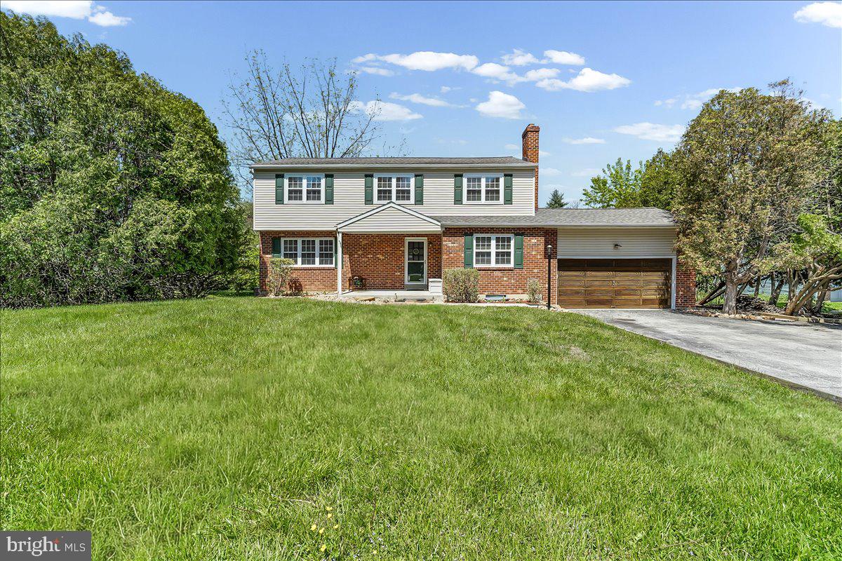 Gorgeous center hall colonial in West Goshen, offering 4 bedrooms and 3.5 baths designed for comfortable everyday living. From the moment you arrive, you feel the warmth, care, and pride of ownership throughout.  The main level features covered entrance foyer with coat closet, large formal living room, dining room with ceiling fan, eat in kitchen with stainless steel appliances that serves as the heart of the home with pantry storage. The main level also features a cozy den with brick fireplace, mud room, and first floor powder room .   Upstairs hosts four bedrooms, each featuring hardwood floors. The primary suite offers its own updated full bath, while three additional bedrooms are serviced by an updated hall bath. The fourth bedroom offers a bonus space, complete with an oversized closet and an additional room that can be used as an office, dressing room, or sitting area. The finished walk out basement is  super cool with a rustic vibe, featuring charming saloon doors, a full bath, wet bar, and direct access to the rear yard, creating the ultimate space for entertaining or relaxing. Basement laundry and abundance of storage. Step outside to the large deck overlooking the expansive rear yard and creek. Roof installed 2021, HVAC 2020, whole house generator 2023, interior doors 2023, bathrooms 2023. This home blends character, function, and modern updates into a warm and inviting retreat you will love coming home to every day. Buyer to independently verify all info including taxes and square footage.