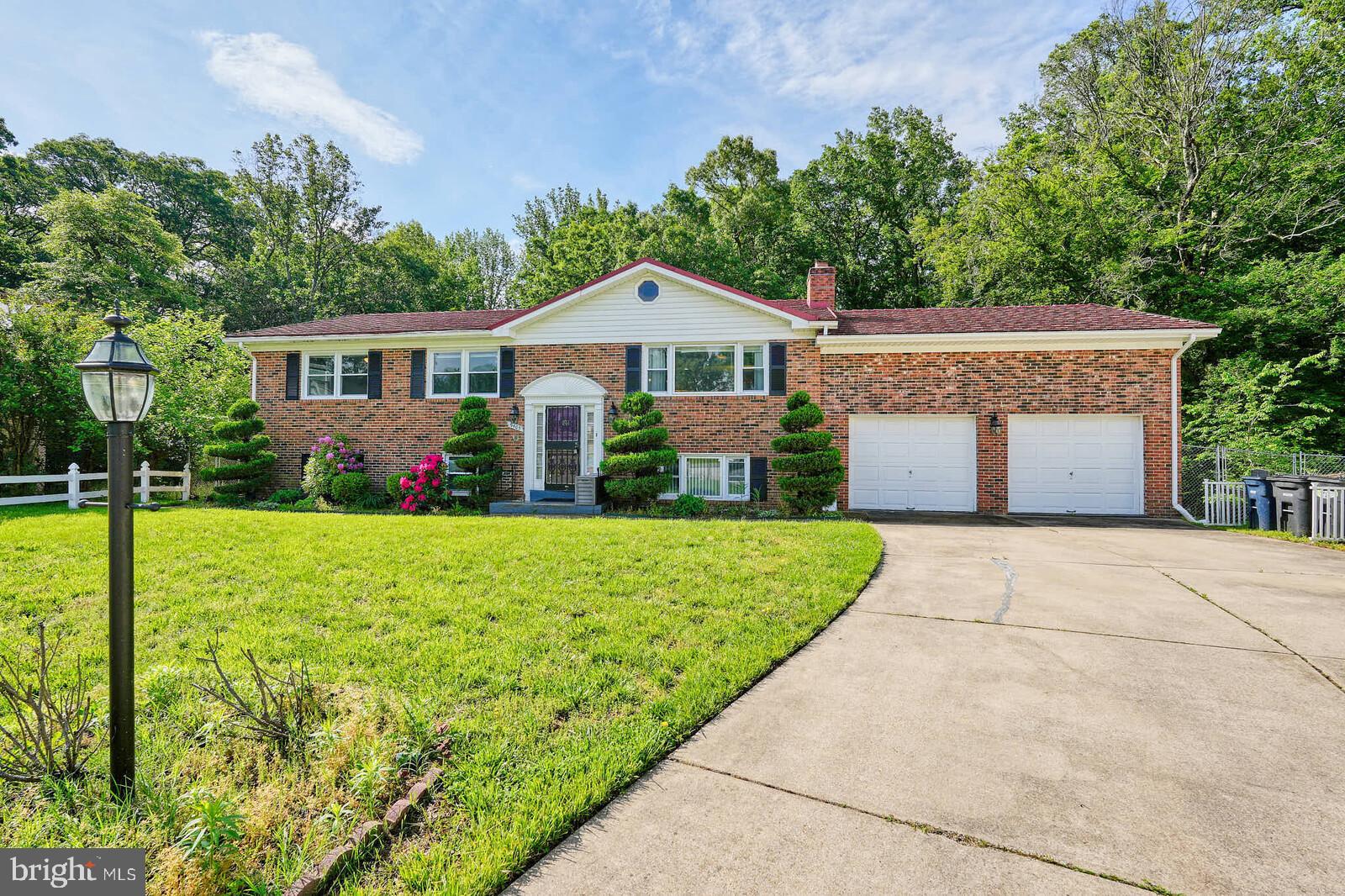 Welcome home! This beautifully updated brick-front split foyer is tucked away on a quiet cul-de-sac and backs to a serene wooded lot with a peaceful stream—offering both space and tranquility. Featuring 5 bedrooms and 3 bathrooms, this move-in-ready home boasts gleaming hardwood floors, a stunning open-concept kitchen with granite countertops, and brand-new French doors that open to a spacious deck with tranquil views. The double-lot backyard, complete with a patio, is perfect for outdoor entertaining, pets, or relaxation. The lower level includes two additional bedrooms, a full bath, a second kitchen, and a separate entrance—ideal for an in-law suite or potential rental income. Recent upgrades include an energy-efficient 80-gallon water heater (2024), an electric infrared fireplace, and a durable gable-style metal roof designed to last longer than most traditional roofs. With an oversized garage and generous parking space, this home checks every box. Motivated seller is open to concessions with the right offer—don’t miss this incredible opportunity to own a true retreat that blends privacy, functionality, and modern comfort. Schedule your private tour today before it’s gone!