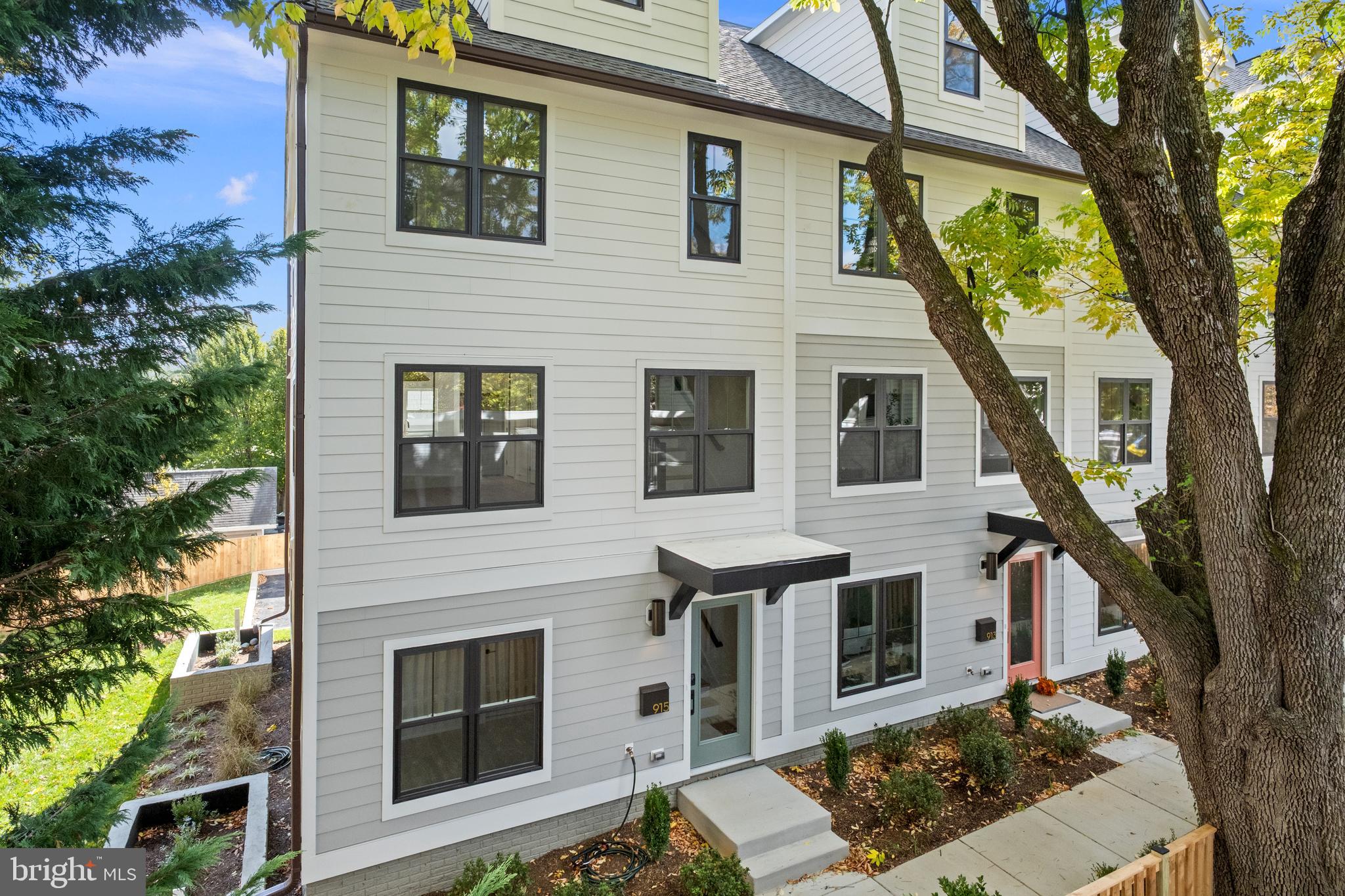 LAST UNIT AVAILABLE!  A rare opportunity for enhanced purchasing flexibility accompanies this MOVE-IN READY  END UNIT townhome at IRVING + NINTH. Qualified buyers may take advantage of a BUILDER PAID RATE BUY DOWN, offering interest rates as low as 5.875% on a 30-year fixed mortgage, with no PMI and up to 85% LTV (free rate float down; additional programs available).

This 4-bedroom new construction residence spans over 2,000 square feet of thoughtfully designed interiors, where wide-plank engineered white oak floors, oversized windows, and clean-lined trim create a modern yet inviting atmosphere throughout. At the heart of the main level, the kitchen features a striking waterfall quartz peninsula—equal parts functional and sculptural—ideal for both daily life and effortless entertaining.

Each bedroom is paired with its own ensuite bath, appointed with furniture-inspired vanities and elevated finishes that evoke a refined, boutique-hotel experience. The private rooftop terrace offers a seamless extension of the home, inviting quiet mornings, evening gatherings, and open-air enjoyment with expansive city views. A two-car garage adds ease, security, and everyday convenience.

Distinct from high-rise living, IRVING + NINTH townhomes provide a rare balance of privacy and connection—set within an urban yet residential setting that delivers the best of city living in an exclusive, low-density community.
