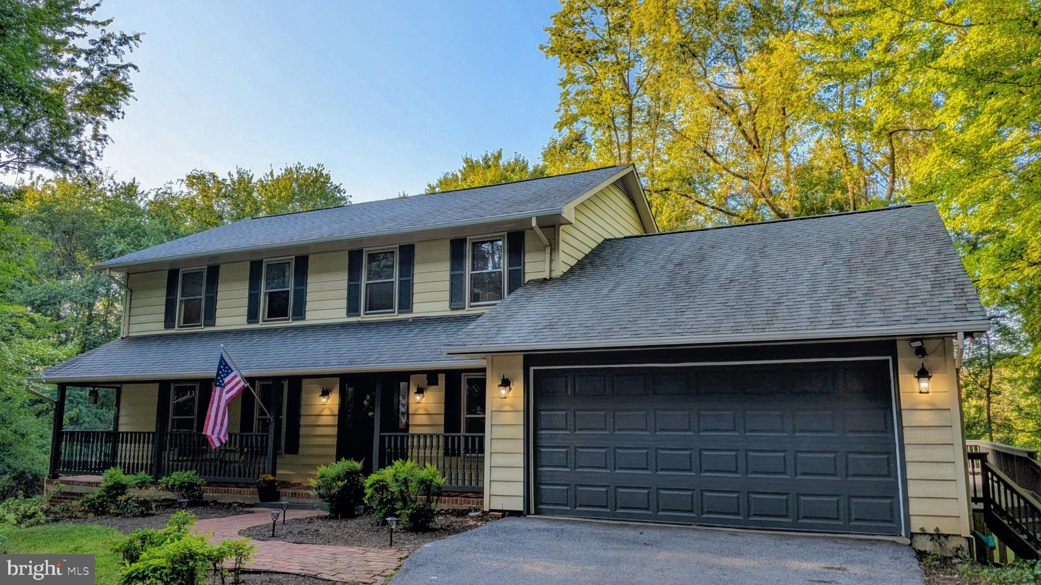 Create your new lifestyle surrounded by nature in this updated classic colonial nestled on a spacious 1.7 acre premium lot in one of Mount Airy’s most desirable, mature neighborhoods. With the perfect balance of towering hardwood trees and flat open areas to play, 5604 Catoctin Ridge Drive offers a perfect parklike setting for peaceful day-to-day tranquility, while providing needed proximity to modern conveniences, exceptional commuter route access, and a top-tier school district. Enjoy three full levels of living space--including 2,100 finished square feet--with four bedrooms (primary bedroom with ensuite bathroom and two closets), two full/one half updated bathrooms, plus a lower level of nearly 1,200 additional square feet with full-size windows and a level walkout with excellent ceiling height and a bathroom rough in for future finish. This traditional colonial gem opens with a full length brick front porch and brick walkway welcoming you home. A large formal living room with ornate custom-carved hardwood window trim is on your immediate left as you enter, across the entry foyer from a perfectly-sized private office/flex room. Your classic kitchen is nestled between a formal dining room and a breakfast nook with bay window, with sight lines into the cozy back-of-house family room that opens onto a massive full-length deck with multiple stairways for access to the stunning backyard. Densely treed views are the star as you look out of every single window of this home--not a disappointing view to be found! Kitchen enhancements include solid wood cabinetry, updated black stainless steel appliances, and granite countertops. All three bathrooms have been aesthetically updated with granite as well, and also feature newer plumbing/lighting fixtures and worry-free LVP flooring. You'll also enjoy updated flooring in all bedrooms and the majority of the main level, bright and efficient LED lighting fixtures, and a classic brick fireplace/hearth newly equipped with an efficient wood burning stove insert, complementing the brand NEW central HVAC system and giving you ample options for home heating year-round.  A long paved driveway with turnaround areas provides ample parking for guests, and the two car garage has a brand new overhead bay door, convenient side door, and access to attic storage. More outdoor features include multiple mature landscaping/beds, pea gravel bed with edging immediately under the deck, huge mature ostrich plume fern patch, established koi pond area, and an accessory pavilion/shed with separate equipment storage section that would make a lovely playhouse or an additional entertaining area. Even better? No HOA to contend with, no elevated municipal taxes, and no water or sewer bills (private well and septic). It's the total package--timeless design, elevated turnkey updates,  and perfectly enveloped in nature, and it is ready for the next owner to make it their personal retreat. More pictures coming soon!