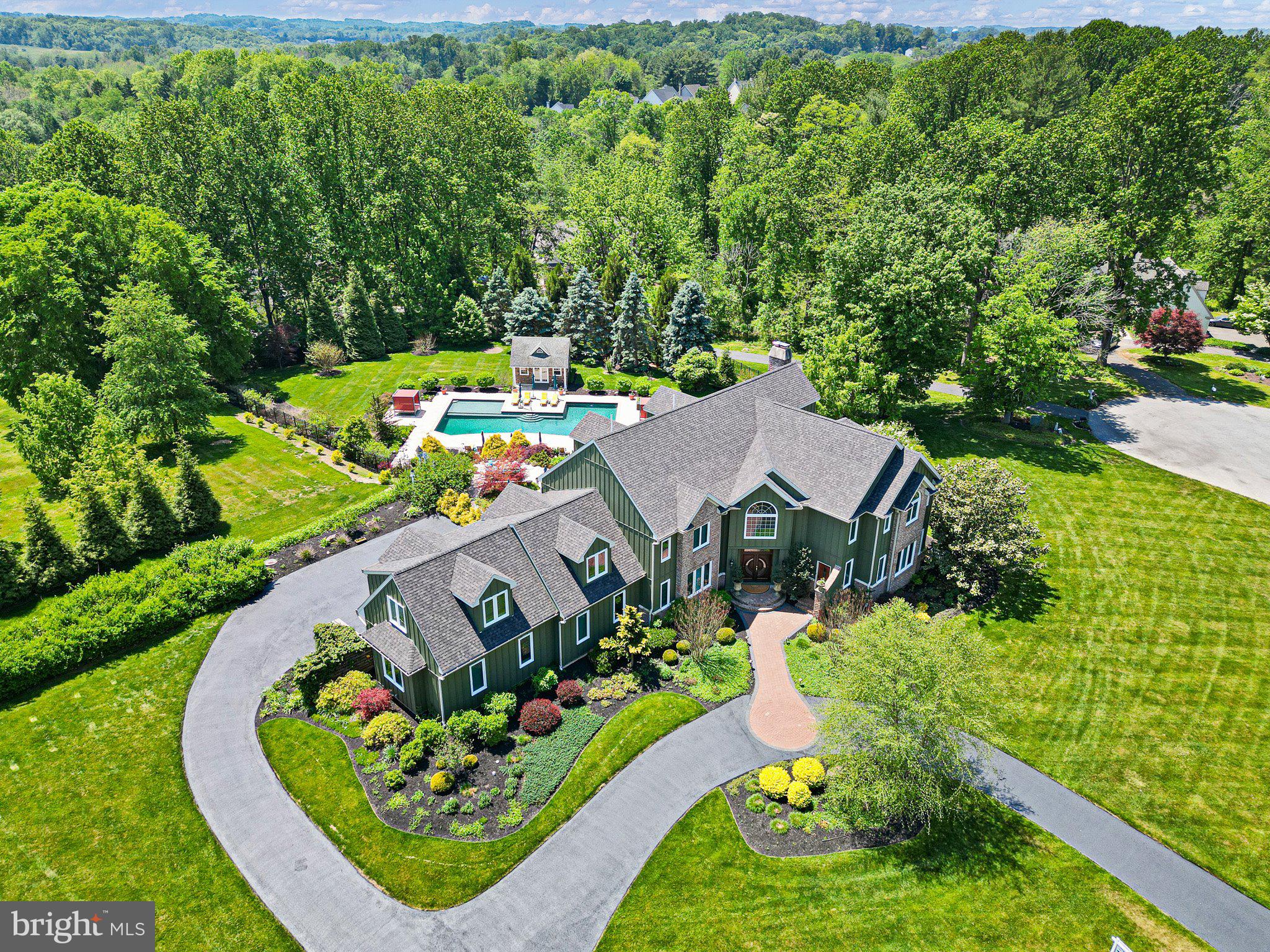 Nestled in the prestigious Indian Springs community, this exquisite traditional residence offers a harmonious blend of luxury and comfort, perfect for those seeking an elevated lifestyle. Spanning over 2 acres, this property is a true sanctuary, featuring panoramic views that invite tranquility and inspire relaxation. Step inside to discover a meticulously maintained interior that exudes warmth and sophistication. The heart of the home is the expansive custom kitchen, complete with a generous island, built-in range, double ovens, and a sleek refrigerator, making it a culinary haven for both casual meals and grand entertaining. The butler's pantry and wet/dry bar add an extra touch of convenience and elegance, ensuring that hosting gatherings is a seamless experience. The inviting dining area flows effortlessly into the spacious living room, where three stunning fireplaces-crafted from brick and stone-create cozy focal points for intimate evenings. Natural light floods the space through energy-efficient windows, enhancing the home's inviting atmosphere. With five well-appointed bedrooms and seven full bathrooms, this residence provides ample space for relaxation and privacy. The main floor laundry adds to the home's functionality, while the fully finished basement, complete with an outside entrance, offers endless possibilities for recreation or additional living space. Step outside to your personal oasis, where a heated, fenced salt water pool awaits, perfect for summer gatherings or peaceful afternoons soaking up the sun. The expansive patio provides an ideal setting for outdoor dining and entertaining, all while enjoying the breathtaking views that surround you. For those who appreciate the finer details, this home is equipped with a central vacuum system and a comprehensive security system, ensuring both convenience and peace of mind. The oversized, rear-entry garage accommodates four vehicles, providing ample space for all your needs. This property is not just a home; it's a lifestyle. Experience the perfect blend of luxury, comfort, and privacy in this exceptional residence, where every detail has been thoughtfully curated to create a warm and inviting atmosphere. Embrace the opportunity to make this stunning property your own and enjoy the exclusive lifestyle it offers. This exceptional custom estate home is ideally situated on a beautiful property in the highly sought-after town of Kennett Square with easy access to Route 1 and I-95 just along the Rte 52 Corridor.