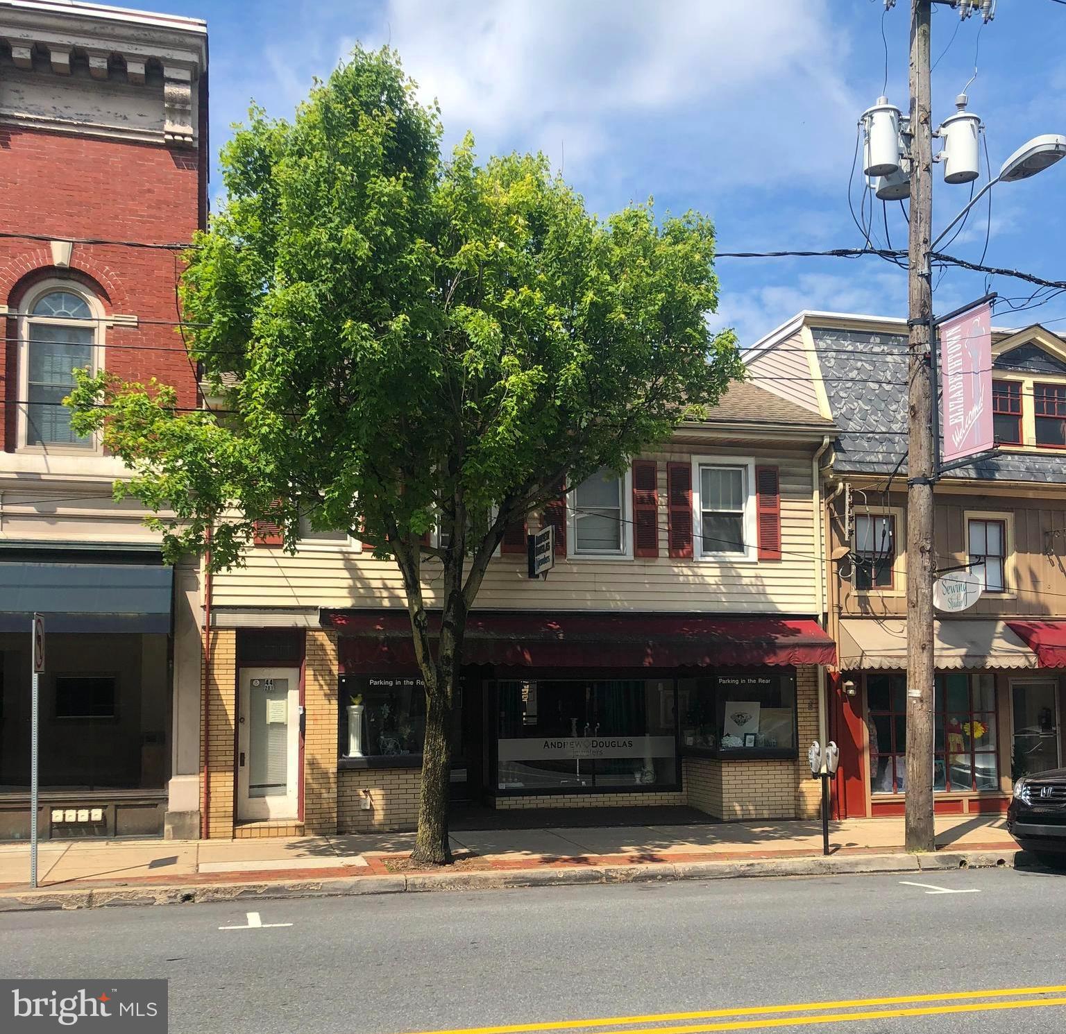 Prime  Commercial Downtown Building with lots of on site parking and a residential dwelling on the second level. The first floor consists of a Storefront/Commercial unit, currently rented for $625.00 per month and the second floor consists of a residential dwelling currently rented for $650.00 per month. Parking is at a premium downtown and this property has excess, therefore additional income can be created by renting parking spaces. The adjoining property can be purchased along with this property . See 44 S. Market St. listing. Call Listing Agent/Owner for additional details.