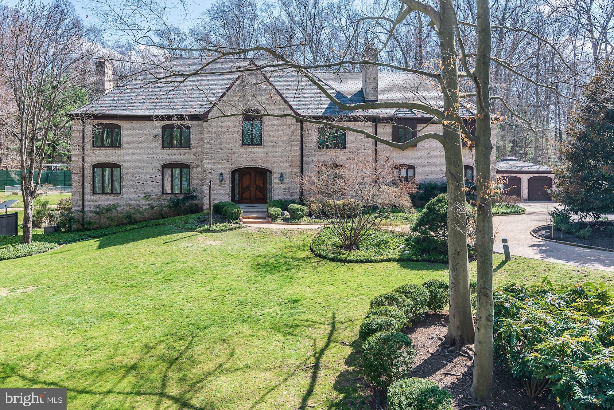 Welcome to this lovely grand residence, on 2.68 acres of private, manicured grounds, with its own tennis court and swimming pool. The beautifully appointed all-brick 14,000+ square foot home offers you a private club environment, with four levels of generous living space, fine details and craftsmanship, extensively updated by its present owners. This unique house offers an opportunity to enjoy life at its fullest - including year-round swimming in the grand attached pool house, grilling on the patio, playing tennis, exercising and enjoying the home's interior luxuries and beautiful natural setting. A long circular drive leads to the imposing home with its impressive slate roof and two separate garages for 5 cars. The impressive entry foyer with sparkling chandelier opens to a sumptuous living room with herringbone teak flooring, a large bar and fine built-ins. The large dining room showcases the home's lovely trim and flooring, accommodating many guests. Beautiful formal spaces are complemented by comfortable rooms for family and friends to play, relax and work. The smashing all-white newly-renovated kitchen provides a large center island, new upscale appliances and a breakfast area with views of the grounds. The adjacent spacious Family Room and Sun Room also overlook the grounds. The large Owner's Bedroom suite comes with its own office or sitting room, huge walk-in closets and two separate bathrooms. Three additional Bedrooms on the upper level all have ensuite baths, and there is large laundry room. The walk-out lower level has been completely updated and offers a great ceiling height,  a large gym, sauna, recreation room with fireplace, an in law-suite with new bathroom, ample storage space, second laundry room and access to an exterior patio. The delightful fully finished top level of the home offers flexible space for storage, a studio and living space. Front and back staircases include a lovely curved front staircase, and there are two staircases to the lower level. 


Amenities include numerous fireplaces, a sauna, a dog-washing station in the garage, pocket doors, central vacuum, renovated bathrooms, two laundry rooms, Cafe, and Thermador kitchen appliances, Subzero and Traulsen refrigerators , and more. Ask your agent for more information on the house located in the agent section of the listing.