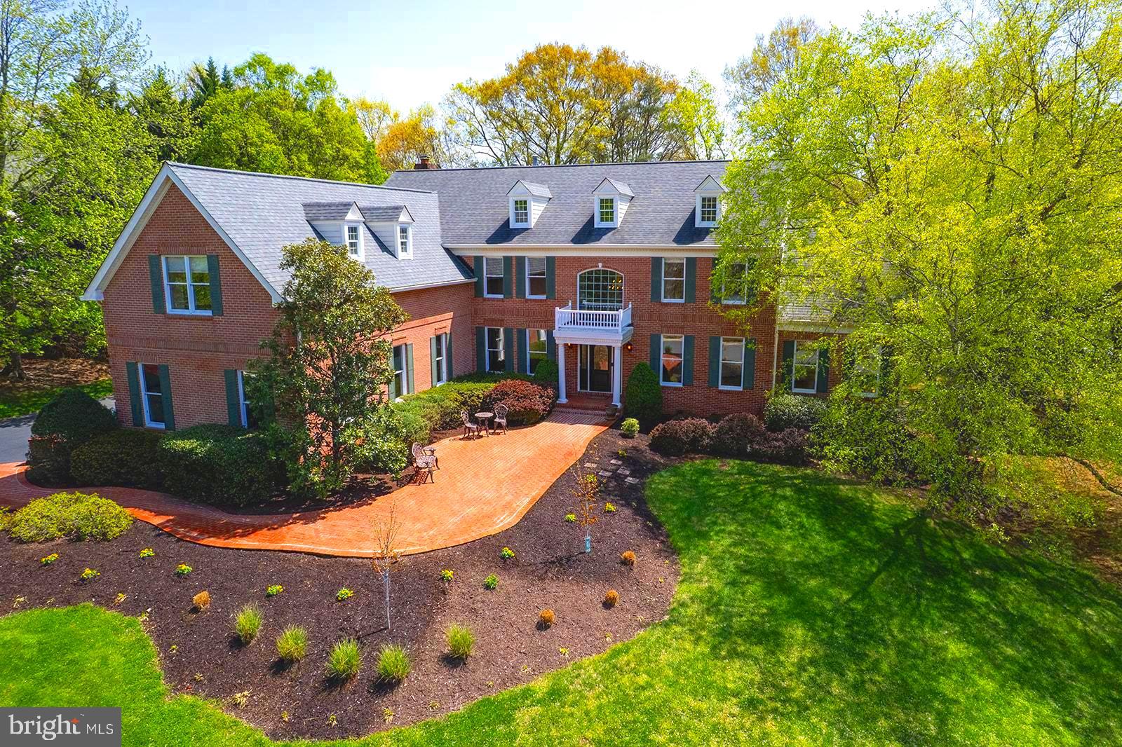 Welcome to 12825 Parapet Way, an exceptional Toll Brothers Colonial nestled in the prestigious Oakton Chase community. This stately residence sits majestically on a beautifully landscaped .83-acre cul-de-sac lot and offers unparalleled curb appeal in a peaceful and private setting, yet in a friendly neighborhood with sidewalks and tree lined streets.  The property boasts 5 bedrooms, 4.5 baths and a rarely available four-car side-load garage.

A gracious paver walkway leads you to the front entry, where you can stop to enjoy breathtaking sunset views from the front patio.  Upon entering the home you will be greeted by the elegant foyer with sweeping staircase and marble floors.  Natural light floods the home, highlighting the walls of windows, high ceilings and lovely formal and informal spaces.  The conservatory with vaulted ceilings, arched windows and fireplace will be a favorite place to gather.  Host holidays in the massive dining room and enjoy the expansive gourmet kitchen with sunroom and a walk in pantry.  The family room impresses with floor-to-ceiling Palladian windows and a striking stone fireplace, complemented by a convenient back staircase.  The library and mudroom round out the functional and flowing main level.

On the upper level, the desirable four-bedroom, three-bath configuration includes a luxurious primary suite with tray ceiling, cove lighting, a double sided fireplace, plus a sitting room, enormous dual walk-in closets, and a dressing area with mirrors and vanity. The lux primary bath features a soaking tub and walk-in shower with marble surround,  and dual vanities. Completing the upper level are two spacious bedrooms that share a buddy bath, and a guest bedroom with ensuite bath and walk-in closet.

The lower level is a haven for relaxation and entertainment, with an expansive rec room, full bath and an in-law suite with a sitting area. Plenty of flex space and storage are an added bonus.  Double doors lead to a private patio and the backyard.

Outdoor spaces are designed for relaxation and gathering, with so many options - barbecue on the back porch, relax in the gazebo, watch sunsets from the front patio and enjoy nature view  and the lower level patio offers a private retreat. The huge yard is perfect for play or pets or set up goals for a soccer match!  There are plenty of options for pool placement should one be desired.

This property is part of the coveted Navy, Franklin, Oakton school pyramid, making it an ideal choice for those seeking top-tier education.   The location is superb being equidistant from the popular restaurants and shopping at Reston Town Center and Fairfax Corner.  Excellent commuter options with easy access to the Fairfax County Parkway, and highways 28, 50, 66 and 495.  Minutes to the Dulles Airport.  

Experience the perfect blend of elegance, comfort, and functionality at 12825 Parapet Way. Don't miss the opportunity to make this exceptional residence your new home.  Open houses Friday 5-7pm, Sunday 1-4pm.