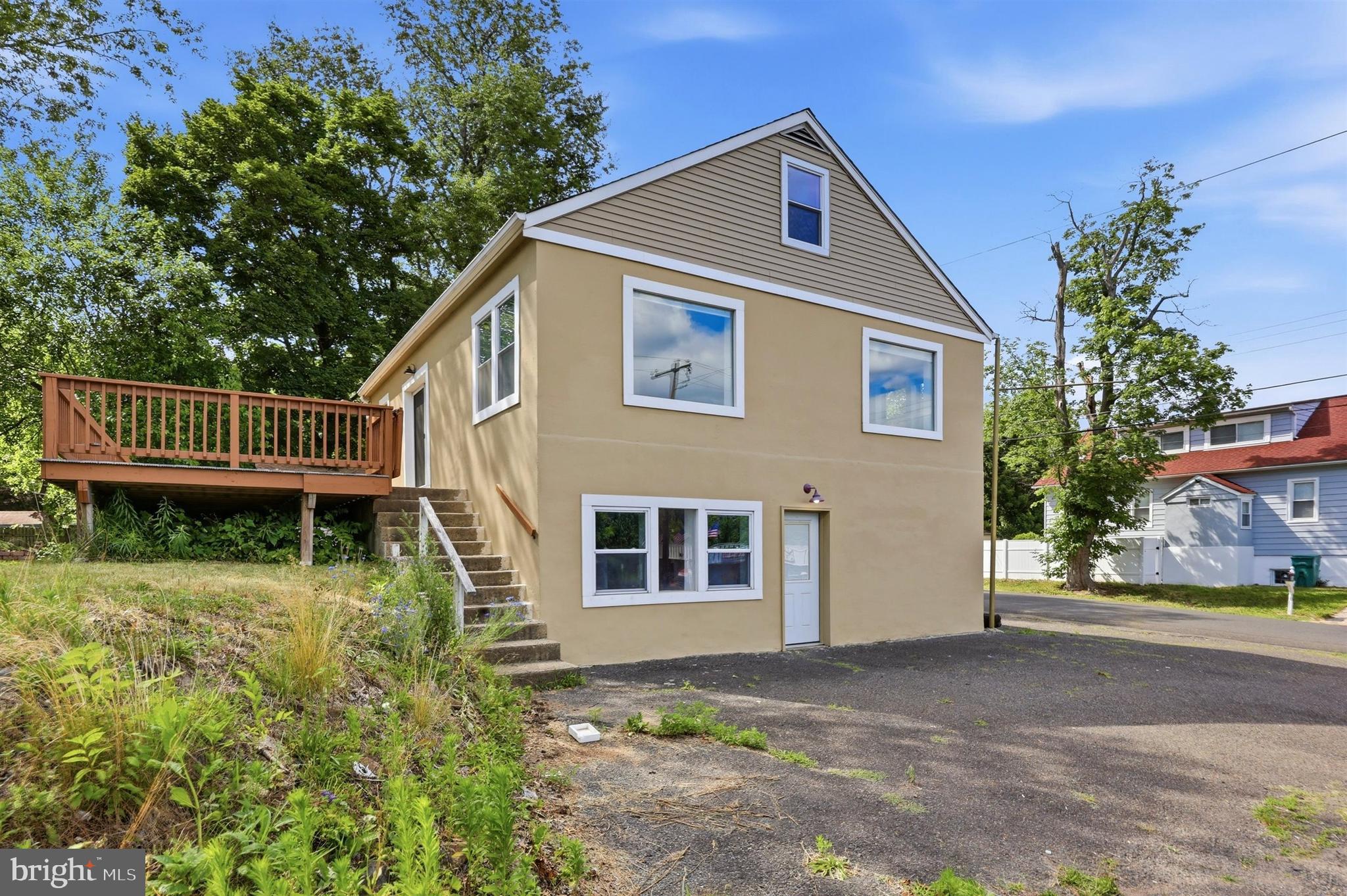 Welcome to 5760 Bensalem Boulevard, a move in ready home offering flexibility, modern updates, and plenty of usable space. One of the unique features of this property is the ground level lower level with its own exterior entrance. This space was previously converted with township approvals for office use by a prior owner, though buyers should verify with Bensalem Township whether their intended use is permitted. The current owners utilize this area as a gym and storage space. The lower level also includes a convenient half bathroom, making it ideal for a variety of uses.

The main living level has been beautifully updated and is ready for its next owner. The heart of the home is the gourmet kitchen featuring white shaker cabinetry, ample counter space, and a full suite of LG stainless steel appliances including the refrigerator, dishwasher, stove, and microwave. The washer and dryer are conveniently located on the main floor for easy everyday living.

The main level offers three bedrooms filled with natural light from the large windows. The primary bedroom includes its own private bathroom, creating a comfortable owner's suite. Need additional space? The upper level provides a versatile bonus area that could serve as a fourth bedroom, home office, playroom, family room, hobby space, or whatever best fits your lifestyle.

Step outside through the sliding glass doors to enjoy the wraparound deck overlooking the yard. You'll also find a greenhouse, garden area, and a spacious shed for additional storage. Conveniently located near major highways, shopping, restaurants, and everyday amenities, this property combines flexibility, functionality, and location. Schedule your showing today.