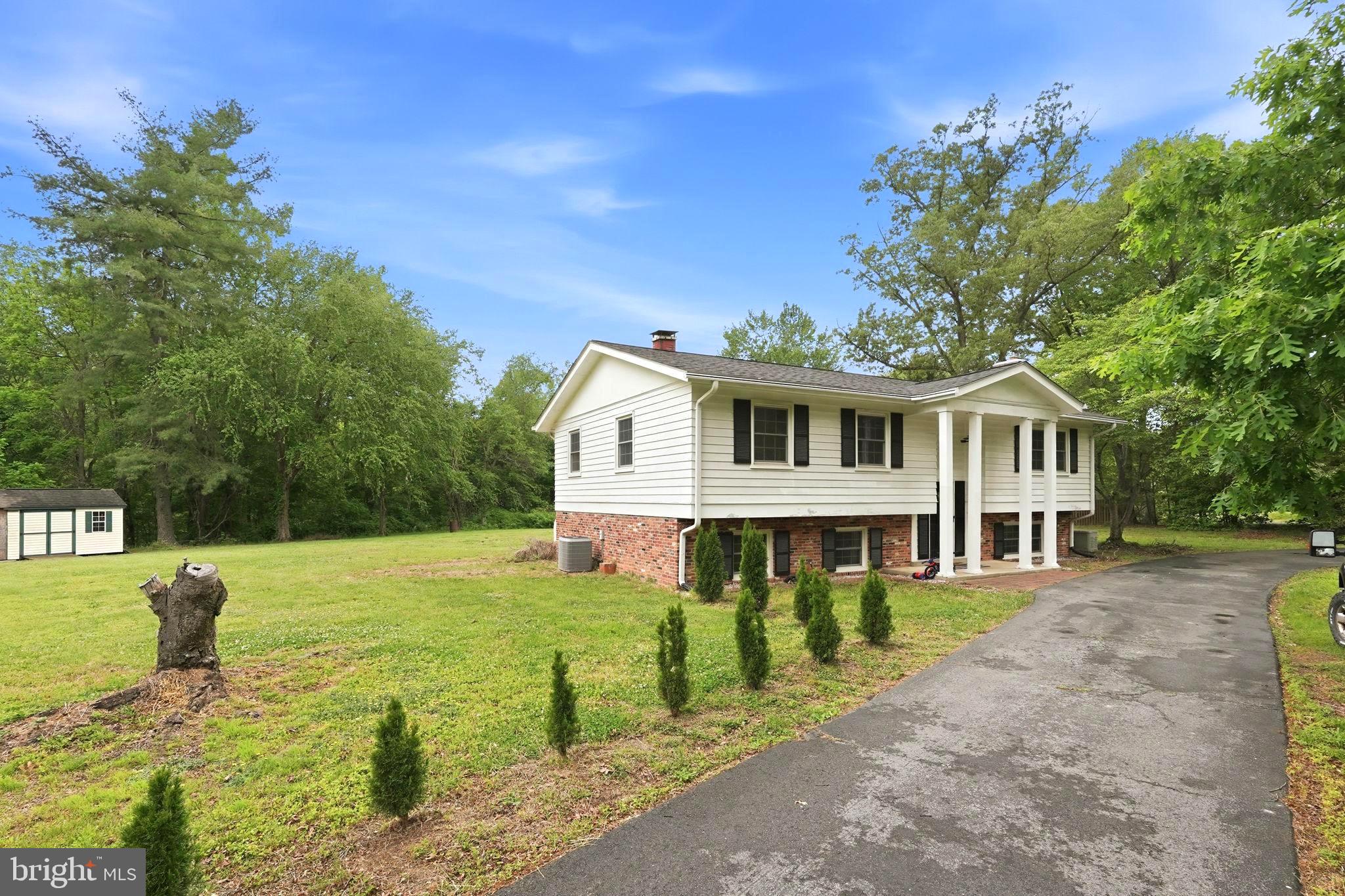 Welcome to 9375 Westfield Dr — a 4-bedroom, 3-bath home set on over 1.5 acres in the established Billingsley Park community of White Plains. Here, space, setting, and functionality come together—paired with a location that offers an easy commute to DC, National Harbor, and the Beltway.

Upstairs, the layout flows seamlessly. The living room connects to the dining area and into the kitchen, where a large center island anchors the space—perfect for everyday living, gathering, and staying connected. The kitchen features stainless steel appliances, modern finishes, and recessed lighting that carries throughout, creating a bright, cohesive feel. Down the hall, the primary suite includes an updated ensuite, with two additional bedrooms and a full hall bath!

The lower level offers a relaxed, flexible space—ideal for a second living area, home office, or whatever fits your lifestyle. A fourth bedroom and full bath provide separation that works well for guests or extended living.

Out back you'll find a spacious deck, patio & shed. A perfect setting to entertain, unwind, and maximize outdoor living. The home backs directly to the 13.4-mile Charles County Rail Trail—offering immediate access to walking, biking, and a lifestyle feature that’s hard to replicate.

With over 1.5 acres and no HOA, you have the freedom to use your space—no limitations, no restrictions, just room to live!