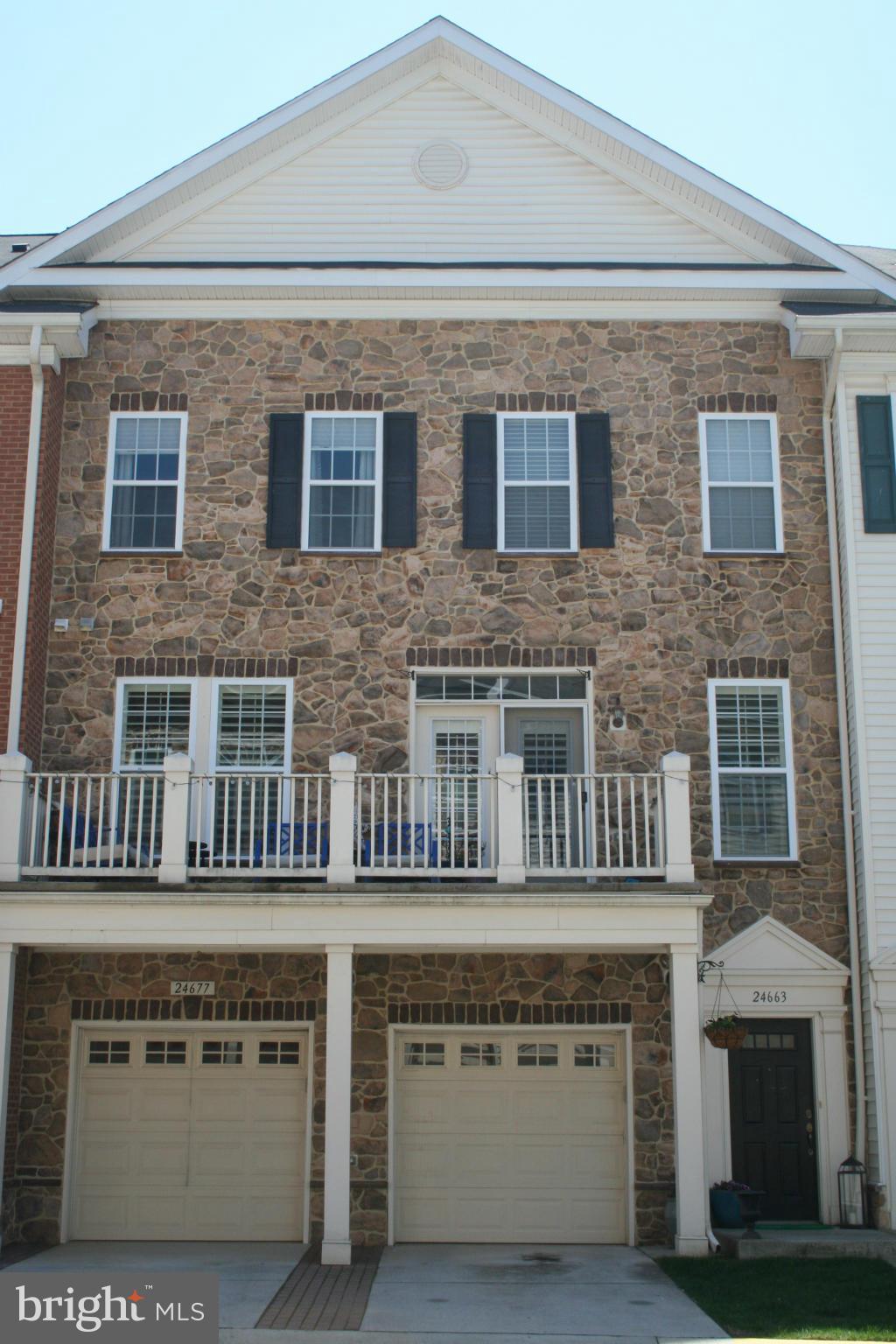 A truly stunning three level town home with a stone front and balcony. Gourmet kitchen with granite countertops, spacious living/dining room with plenty of windows and plantation shutters.  Gleaming hardwood throughout the main level.  Large master bedroom with separate deluxe tub/shower and large walk in closet.  Close proximity to the shops and restaurants of Stone Ridge, as well as Rt. 50.