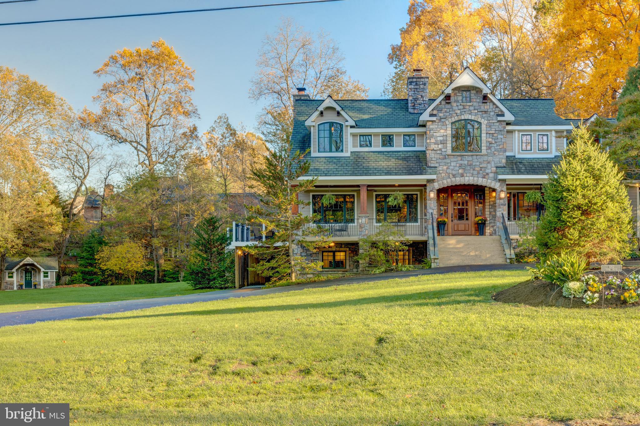 Available now! Stunning McLean Home on 1.7 beautiful acres of land. Convenient easy access location close to Tysons metro, shopping and restaurants - yet the feel of being in the country with expansive green lawn and stately surrounding trees. Gorgeous 4,365 SF craftsman style home built for the builder's family with welcoming veranda, stately entrance via a circular driveway, and a separate office hideaway, perfect for home office, art studio, or kids' playhouse. Architectural Digest quality upgrades including a spacious 1,000-bottle cedar wine cellar, 3 wood-burning stone fireplaces. Spacious living area with lots of windows, vaulted ceiling and ceiling fans. Picture windows throughout allow you to enjoy the scenic outdoor space. Hot tub on entertaining deck and inviting fire pit table off of the family room. Large gourmet kitchen with granite counters and custom wood cabinetry, bar seating, handsome wood flooring. Deck furniture included. Weber BBQ. Entertainment room has plenty of space for relaxing and a game table. Pool table is included. Extra fridge/freezer. TVs in family room and lower level. Four spacious bedrooms plus nursery/home office which could also function as a small bedroom. Well appointed baths include primary bath with double sinks and large vanity with marble counters. Breathtaking veranda and vistas! Great location!!!! Generac generator. Well system. Includes pool table, BBQ grill, fire pit and chairs, hot tub, 2 TVs, fireplace equipment, mirror on stairway, and so much more.