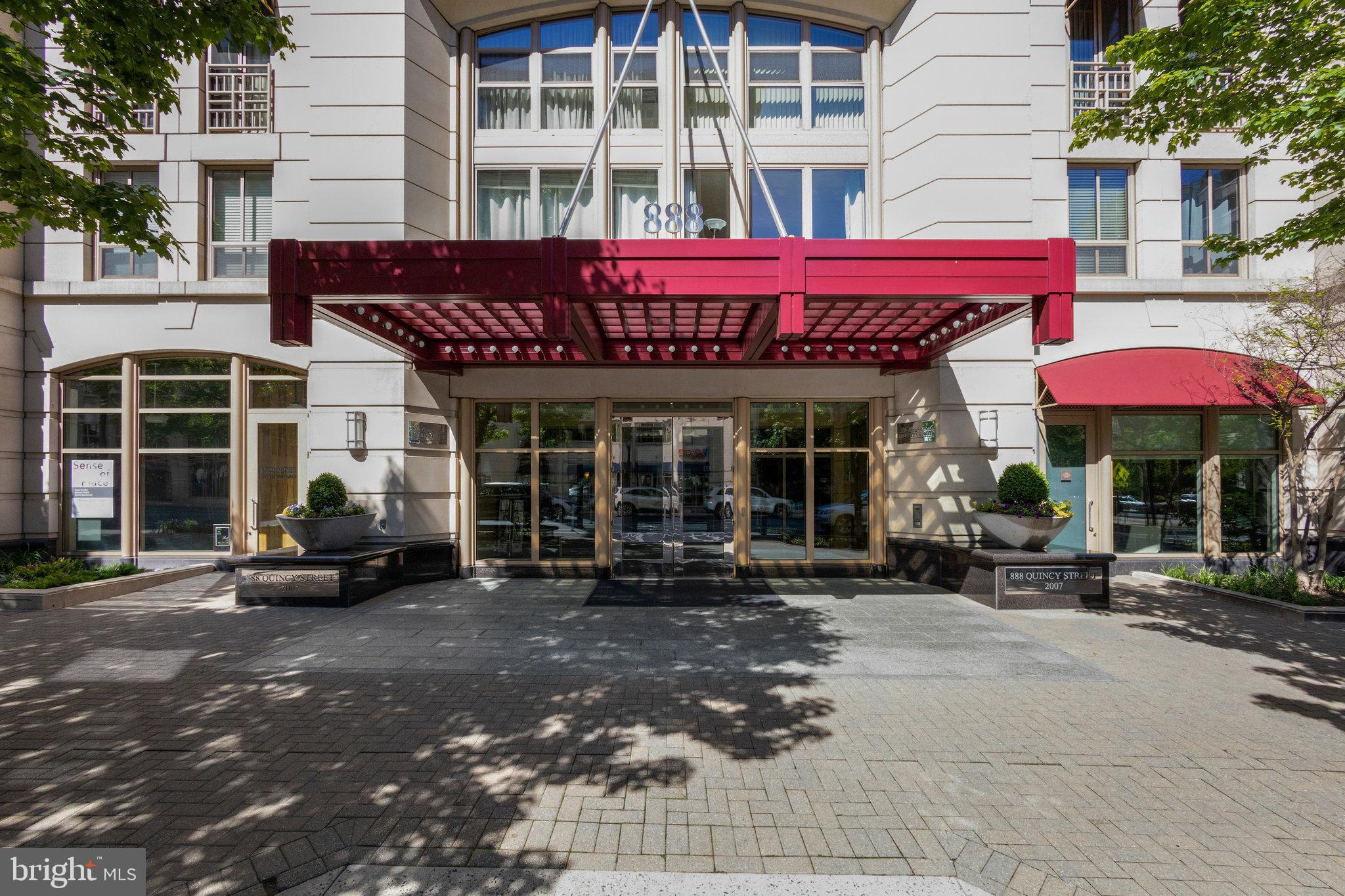 ENJOY LUXURY AND CONVENIENCE in the heart of Ballston in The Residences at Liberty Center. Light and bright condo has hardwood floors in the kitchen and Great Room. Kitchen has granite countertops, a breakfast bar, and stainless appliances. Living room has floor to ceiling windows and doors and leads out to the balcony overlooking the private courtyard. The rooftop balcony overlooks the Washington Monument and DC, and features a swimming pool. Other amenities include a fitness center and 24-hour concierge. Monthly fee includes water, trash and sewer. IDEAL LOCATION between 2 Metro stations- Ballston and Virginia Square- and great dining and shopping.