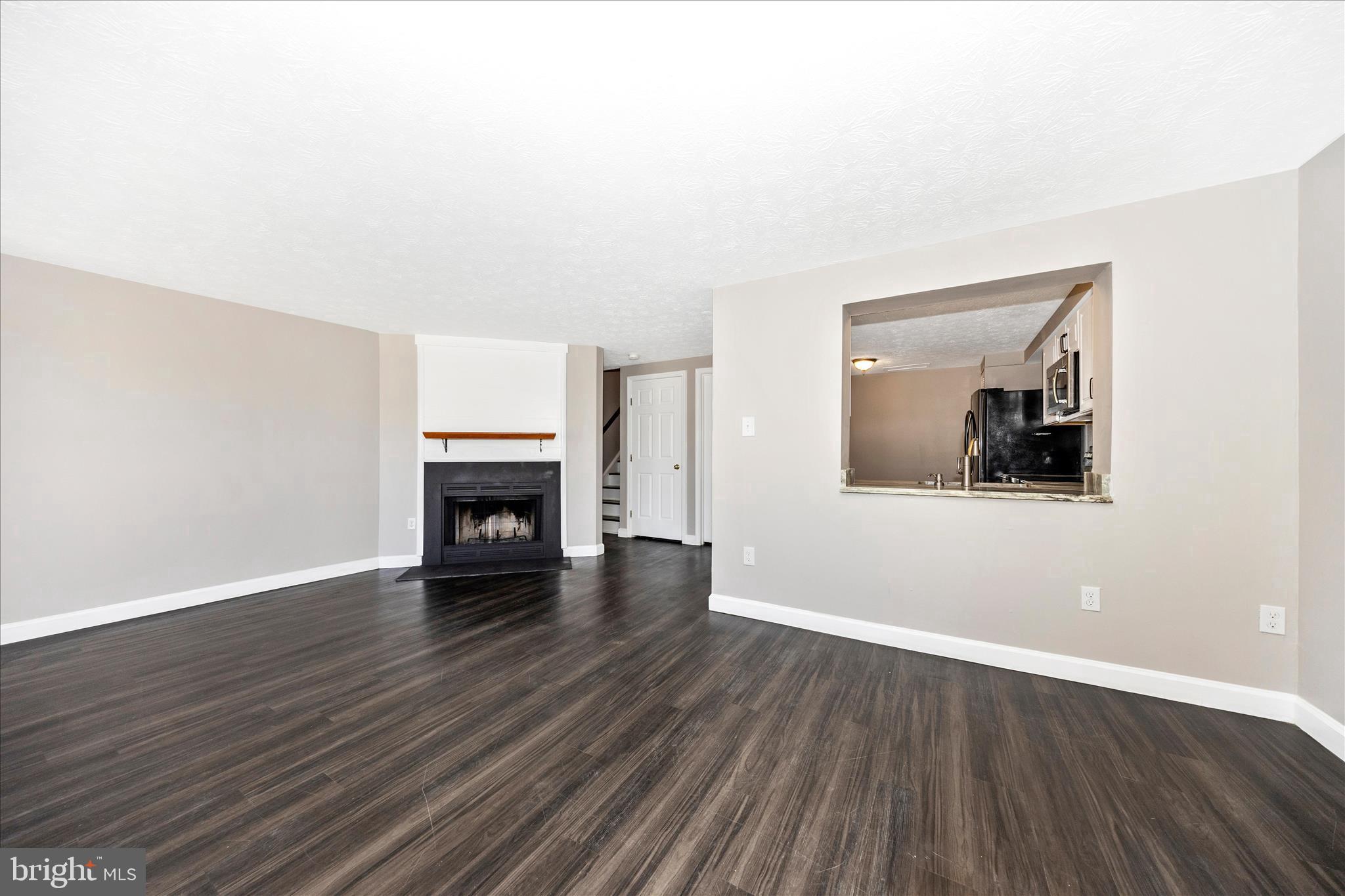 If you are looking for a move-in ready home, 572 Hollyberry Way is IT!  This newly renovated, 3-level townhome has a HUGE primary bedroom and has been updated from top to bottom: new kitchen, new primary bath and 2nd bath, NEW WINDOWS throughout the ENTIRE house, new appliances with a newer refrigerator, new LVP flooring throughout, including the bedrooms. Wood stairs to the upper levels have been stained and look brand new. Furnace replaced approx  2023. The laundry room is on the 2nd level with the bedrooms. WAIT, a fireplace TOO?? All this, and just minutes from downtown Frederick, restaurants, bars, parks, and more. Come and experience all the Frederick has to offer, and be the envy of the neighborhood!