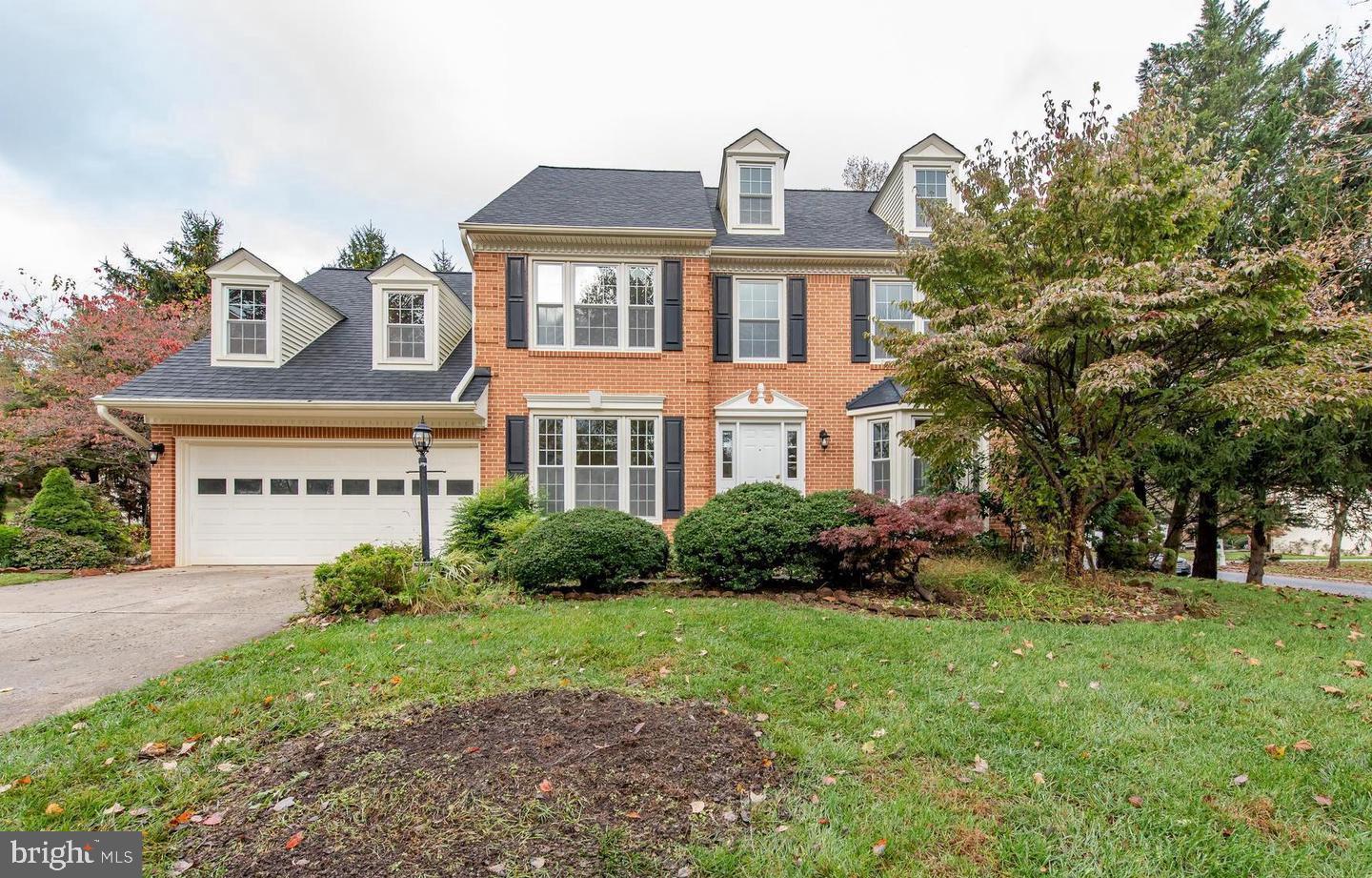 Located in sought-after Burleigh Manor on a 0.41 acre landscaped homesite is this brick-front colonial displaying freshly painted interiors, enriched hardwoods, an inviting foyer featuring French doors to the study, a formal living room with a bay window, and a formal dining room with a brilliant bay window and beautiful trim and moldings. Fashionable skylights brighten the family room enhanced by a vaulted ceiling, a brick wood-burning fireplace, a step up to the bordering kitchen, and glass sliders to the 15x15 screened porch and deck. Chef?s kitchen boasts porcelain tile floors, stainless steel appliances, attractive granite counters with matching backsplash, Shaker style cabinetry, and a center island overlooking the breakfast room with large windows looking to the backyard. Owner's suite presents a walk-in closet, a second double closet, and a garden bath with a double vanity, a glass enclosed shower, and a delightful soaking tub. The lower level boasts a rec room, a game area, a bonus room, a full bath, and a walk-up to a verdant backyard. Adding to the extras: all new Thompson Creek windows and doors guaranteed for double life, architectural shingle roof, sized up gutters and gutter guards, refreshed skylights, and newly installed HVAC. Welcome home! Minimum 650 credit score.