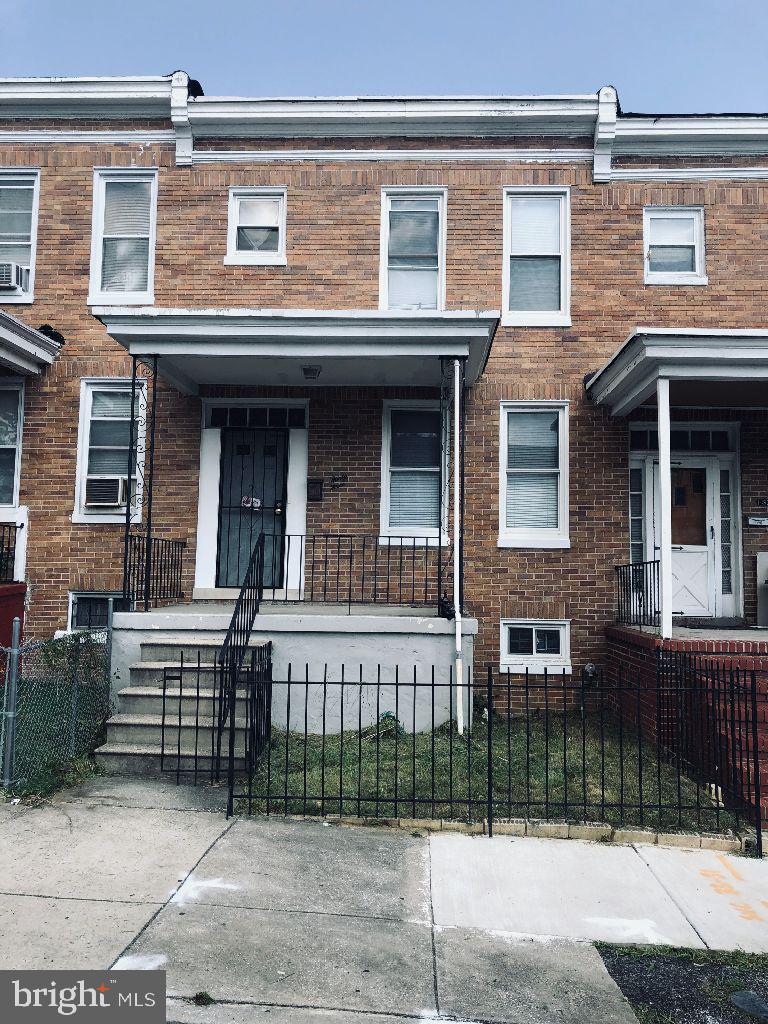 Great chance to own this solid brick townhouse  in Baltimore City, Maryland.  Home features spacious room sizes,  hardwood floors in main level and upper level, separate dining room, covered front and rear porches,  and a large fenced rear yard. The full basement has lots living space and storage.  Convenient location - near schools, shopping and commuter routes. A few minutes from Downtown Baltimore and  Harbor East.