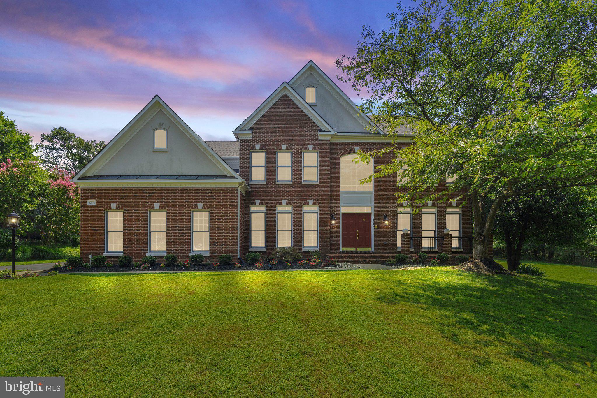 Welcome to your newly revitalized (July '24) home, where modern elegance blends with an open, airy floor plan offering over 5,700 sq. ft. of finished living space. Set on a tranquil 1.03-acre lot in Fairfax’s prestigious Oak Hill Estates, this sophisticated property showcases a stately brick façade, 3-car sideload garage, and mature trees. Ideally located near major commuter routes, shopping, dining, and medical facilities, it also offers access to a top-rated school pyramid—Oakton HS! Step around back to the expansive custom paver patio with refined retaining walls and built-in lighting--perfect for gatherings! Enter through your front double doors into a sun-drenched 2-Story Foyer with a decorative chandelier (July '24) and newly refinished hardwoods (July '24). An elegant curved hardwood staircase with a new designer carpet runner (August '24) leads to an Upper Level balcony overlooking your grand entrance. The freshly painted Main Level (July '24) features refinished hardwoods throughout (July '24) adding to a seamless flow between spaces. A Private Study with french doors offers a quiet retreat, while the Living Room with floor-to-ceiling windows flows into the Dining Room boasting a stylish chandelier (July 2024) and exquisite crown and chair rail mouldings. The Chef’s Kitchen features brand new GE Café stainless appliances (June '24), granite countertops/backsplash, and 42” cabinetry with upgraded pulls (July '24). The center island, with a vented hood (August '24) and plumbed for a future prep sink, combines style and functionality. The Gourmet Kitchen opens to a Breakfast Room with an atrium door to the patio, and the adjoining Family Room has a vaulted ceiling, wood-burning fireplace, and additional patio access. Completing the Main Level are a back staircase, fully remodeled Half Bath (July '24), and an updated Laundry/Mud room with new tile (July '24) and utility cabinet/sink (July '24). Ascend to the Upper Level, where new designer carpet (August '24) enhances both staircases and all bedrooms. The Primary Bedroom Retreat features double doors, tray ceiling with ceiling fan (July '24), Sitting Room, and a walk-in closet with a closet system. The spa-like Primary Bath, fully renovated (July '24), boasts raised double vanities with marble countertops, a standalone tub, elegant fixtures, stylish tile flooring, seamless glass walk-in shower with designer tile, and a water closet. The additional bedrooms are spacious with generous closets, new ceiling fans (July '24), and fresh designer carpet (August '24). Bedrooms 2 and 3 open to a renewed (July '24) shared Full Bath with a double vanity with quartz countertops (July '24), a shower/tub with tile surround, and upgraded fixtures, while Bedroom 4 features an ensuite Full Bath with quartz-topped vanity (July '24) and similar updates (July '24). The sunlit, walk-out Finished Lower Level offers a spacious Recreation Room with a wet bar with granite and a new backsplash (August '24), Den/Bedroom 5, Media Room, and a renewed (July '24) Full Bath with a quartz-topped vanity (July '24) and tub/shower with tile surround. UPGRADES GALORE:  Roof  (March '18), Zoned HVAC--Furnace (UL '19 / ML '22), water heater (June '24), refinished hardwoods (July '24), fresh paint throughout (July '24), designer carpet (August '24), Upper Level ceiling fans (July '24), upgraded interior door hinges/handles (July '24), all baths--either fully or partially--upgraded (July '24), updated lighting throughout (July '24), brand new GE Cafe Kitchen appliances (June '24), new asphalt driveway (March '24), power washed exterior (June '24), replaced majority of exterior doors ('17), garage door openers ('20), modern 12x24 tile flooring in Finished LL (Dec '19), most window blinds (July '24), and much more!  ***Be sure to check out:  Additional interior photos, video & 3D tours***