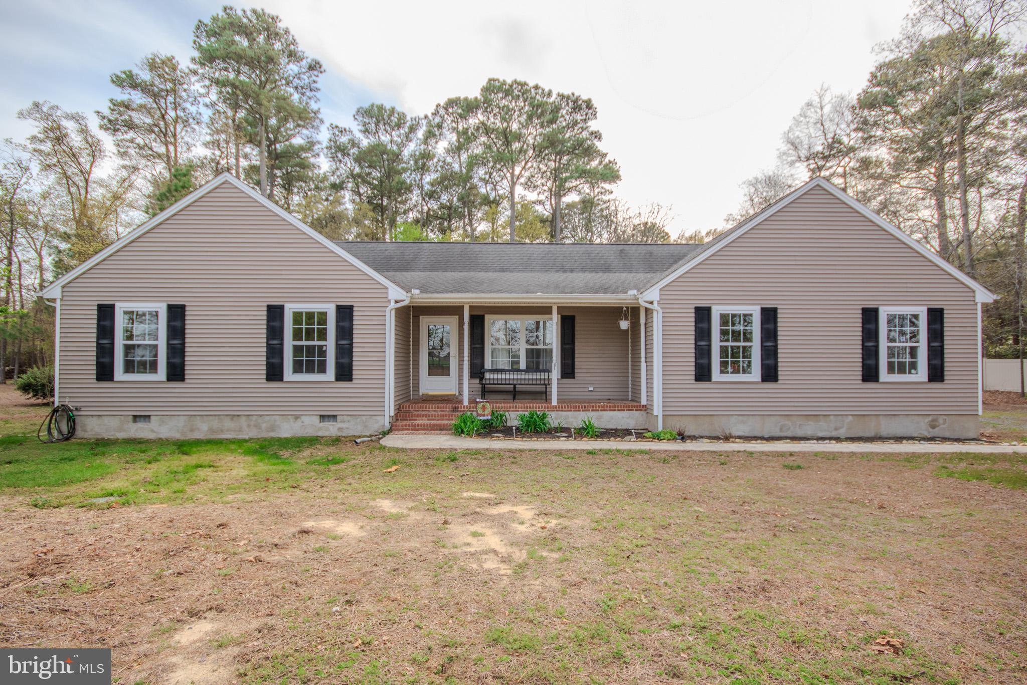 Welcome to this charming 3 bedroom 2 bathroom home nestled on a picturesque 2 acre lot in Mardela Springs.  This property boasts a perfect blend of cleared and wooded areas, providing both open space and natural privacy.  Inside, you'll find a sunroom with brand new flooring and an updated HVAC system to ensure comfort year-round.  The kitchen has been freshly painted and features new lighting and hardware, adding a modern touch.  Outside enjoy the convenience of an attached 2 car garage.  Outside there is a chicken coop and additional storage shed.  Recent updates include refreshed bathrooms and a freshly painted interior. Just down the road is a public boat launch on Barren Creek that feeds into the Nanticoke river.   Don't miss the opportunity to make this lovely property your new home!