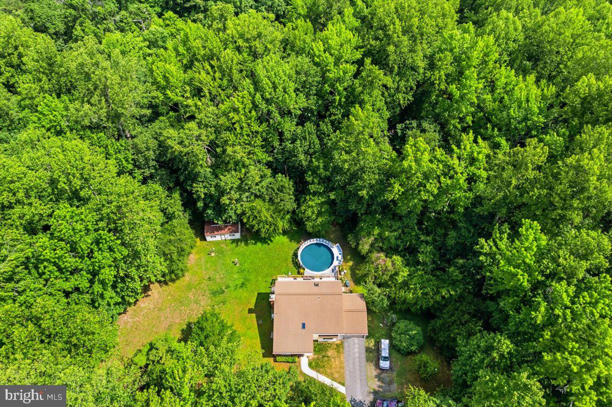 Welcome home to this charming property situated on 3 flat, open acres in the heart of Huntingtown! With plenty of room to spread out both inside and out, this home offers a comfortable layout and great spaces for everyday living and entertaining.
The main level features a bright living room with cathedral ceilings, a separate dining room, and a spacious kitchen that opens to the family room. From there, step out onto the large deck overlooking the above-ground pool—perfect for summer gatherings and relaxing evenings at home. You'll also find a convenient half bath and a large laundry room with its own exterior entrance. New LVP flooring has been installed in the dining room, kitchen, foyer, and bathrooms, adding style and durability throughout these high-traffic areas.
Upstairs, the primary suite includes a private bath, while two additional bedrooms share a full hall bath.
Outside, enjoy the privacy and possibilities that come with 3 usable acres, whether you're gardening, playing, or simply enjoying the open space. Additional features include a one-car garage, an above-ground pool with a new liner and motor, and a fantastic location close to schools, shopping, and everything Huntingtown has to offer. New water softener (Aug 2023), water heater 5/6 years old, inside/outside hvac (Oct 2020), roof 8/10 years old.