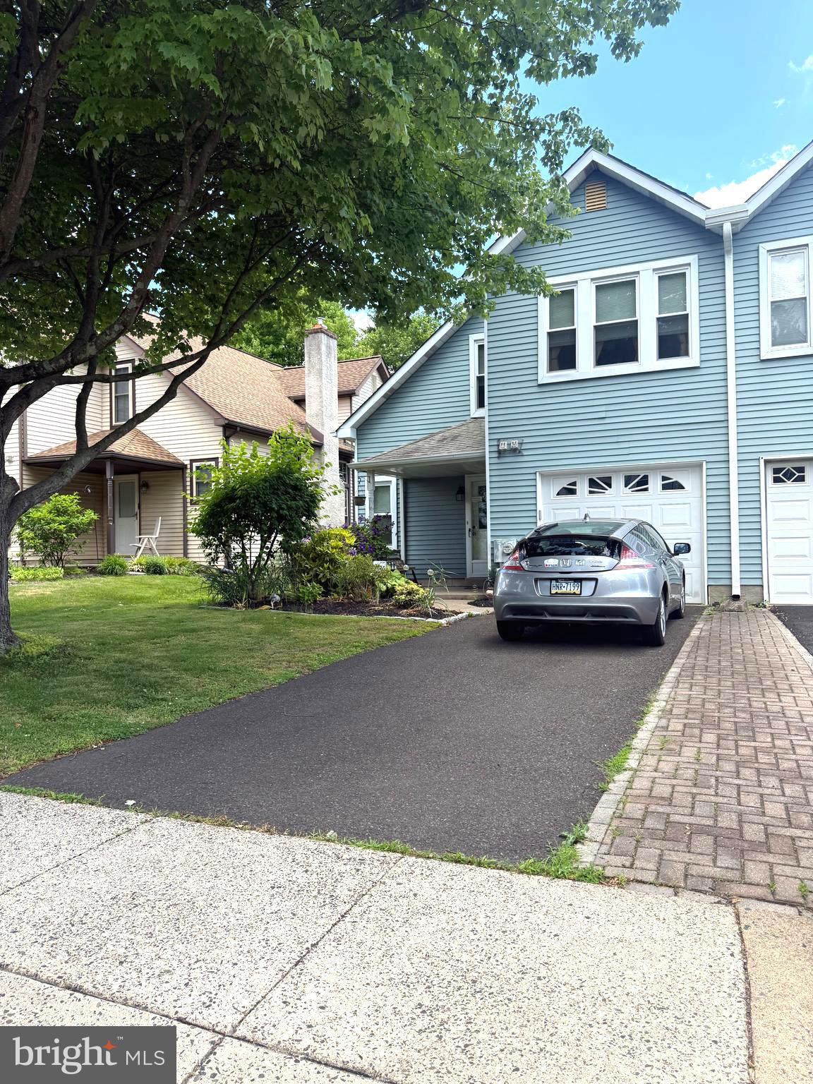 You won't be disappointed with this spacious 3-bedroom, 1½-bath twin home with a one-car garage, ideally situated on a quiet, tree-lined street in the sought-after Horshamtowne community. Offering a bright and open layout, this home is perfect for comfortable everyday living and entertaining.
Enter through the covered front patio into a welcoming foyer with a large coat closet. The expansive living room features a dramatic vaulted ceiling and flows seamlessly into the dining room, creating an airy and inviting space. The eat-in kitchen offers a tile floor, stylish glass tile backsplash, and a door leading to a lovely paver patio overlooking the lush green backyard—an ideal setting for outdoor dining or relaxing.
A convenient powder room completes the first floor. Upstairs, the loft-style hallway overlooks the living room below, adding to the home's open feel. The spacious primary bedroom features ample closet space and direct access to the full hall bathroom. Two additional bedrooms provide flexibility for family, guests, or a home office.  Additional highlights include a one-car garage with inside access and keypad entry, a private driveway with parking for two cars, and a fantastic location close to shopping, restaurants, parks, and major commuter routes.  This wonderful home combines space, comfort, and convenience in a desirable neighborhood. Schedule your appointment today!