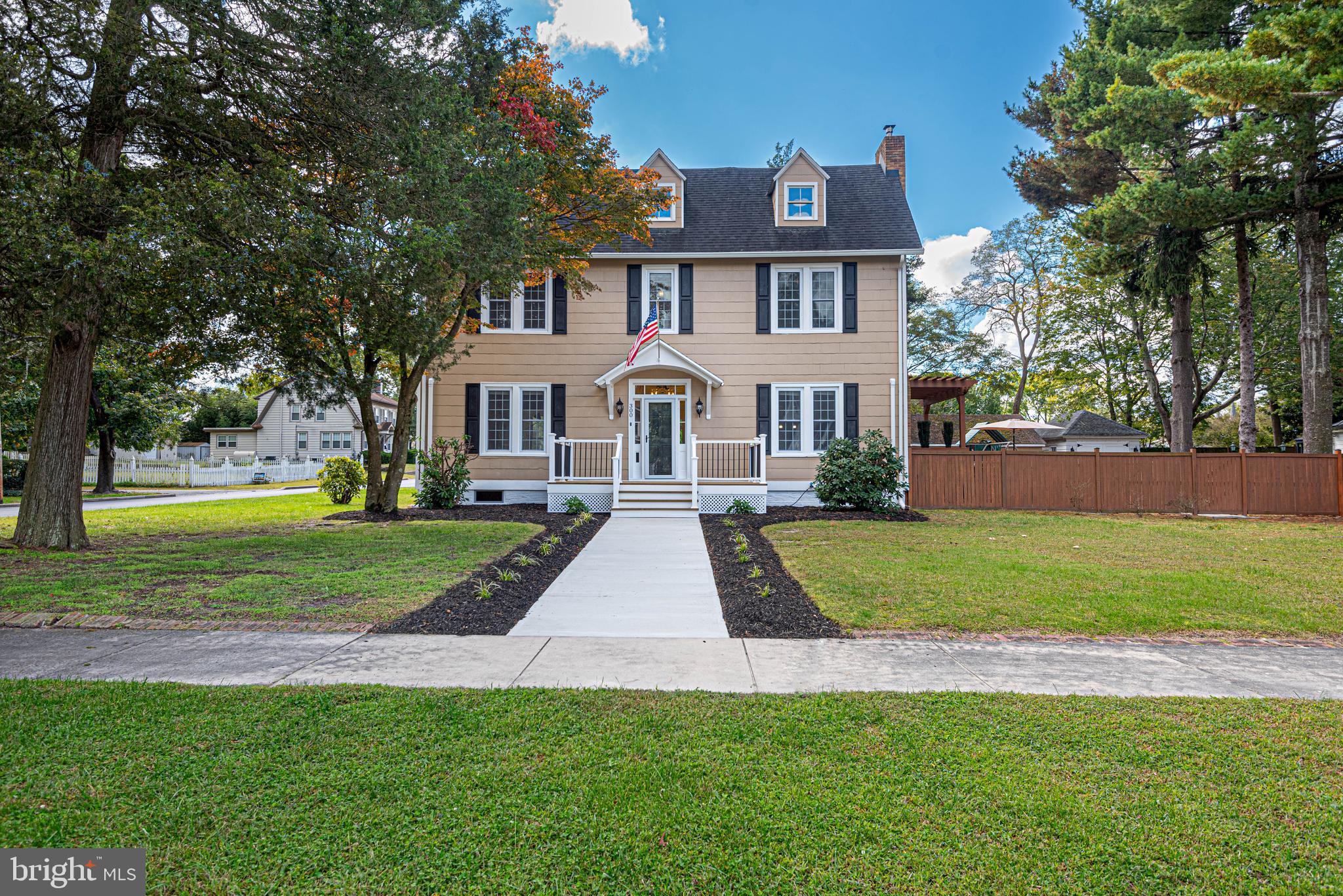 This beautiful 1900 Federal-style home is in the heart of the city and has been renovated and updated. It features a symmetrical façade with a new central front porch entrance flanked by two large windows on either side. This home has a traditional floorplan with an open feel. The interior boasts high ceilings, hardwood floors, archways, intricate moldings, French doors, new windows. The spacious living room is perfect for entertaining guests while the cozy family room is ideal for relaxing. The upgraded kitchen features stainless steel appliances, granite countertops, breakfast bar and tile floors. Upstairs you will find four spacious bedrooms and two bathrooms. The primary bedroom has a walk-in closet and a large en-suite bathroom. Exterior features include beautiful landscaping, multilevel decks with a pergola, front porch, screened-in back porch, slate and brick walkways, fencing around the back and side yards, and a large driveway. A few of the major upgrades are new windows, a new roof, ductless split units, heated tile floors, multilevel decks, updated electric, natural gas Rinnai tankless hot water heater, woodstove and many more upgrades have been added.  Close to restaurants, shopping, community parks, Tidal Health & Salisbury University. This an incredible must-see home!