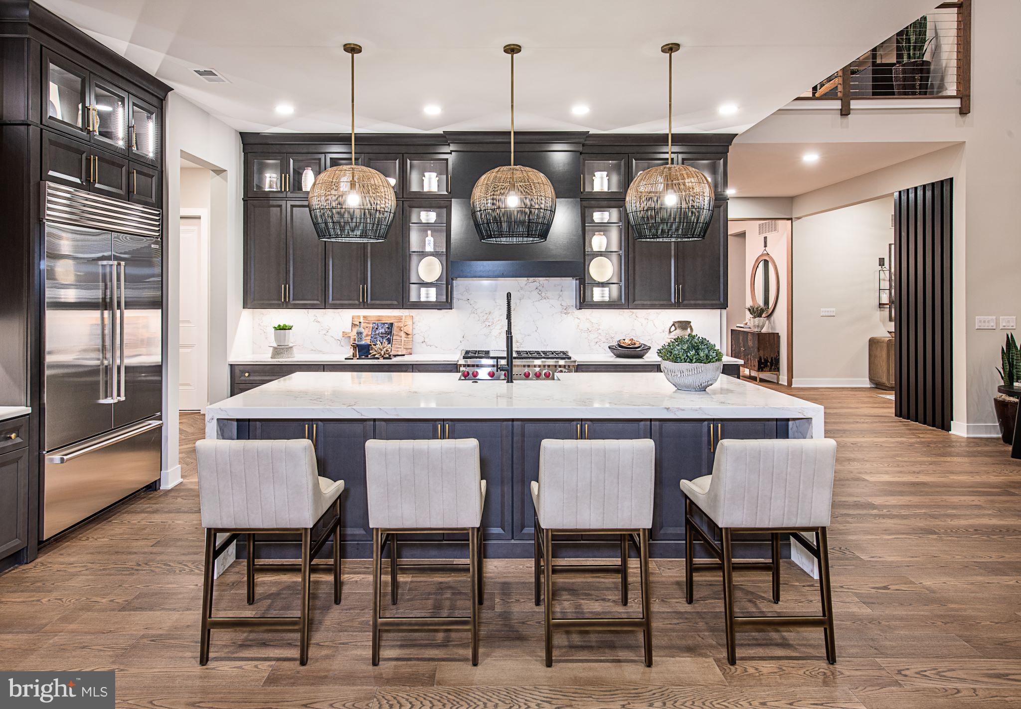 Discover a luxurious lifestyle in this exquisite new construction home. Nestled on a generous half-acre lot, this traditional-style residence offers an unparalleled blend of elegance and comfort, perfect for those who appreciate high-end living. Step inside to experience an open floor plan that seamlessly connects the living spaces, creating an inviting atmosphere ideal for both relaxation and entertaining. The gourmet kitchen is a chef's dream, featuring top-of-the-line stainless steel appliances, including a built-in microwave, cooktop, and wall oven. The spacious pantry provides ample storage, ensuring that your culinary adventures are always well-equipped. Recessed lighting throughout the home enhances the ambiance, while the engineered wood and ceramic tile flooring add a touch of sophistication. The heart of the home is the cozy living area, complete with a fireplace that promises warmth and charm during cooler evenings. With four generously sized bedrooms, including an entry-level bedroom, this home is designed for comfort and convenience. Each bedroom features walk-in closets, providing ample space for your wardrobe and personal belongings. Indulge in the luxurious primary bath, designed as a personal retreat with modern fixtures and finishes. The additional three full bathrooms and one half bath ensure that everyone has their own space, making mornings a breeze. This property is not just about the interior; it also boasts energy-efficient windows that contribute to a sustainable lifestyle. The unfinished basement offers endless possibilities for customization, whether you envision a home gym, entertainment area, or additional living space. Outside, the side-entry garage accommodates two vehicles, with additional driveway space for guests. The community amenities include a scenic jog/walk path, perfect for leisurely strolls or invigorating runs. This home is more than just a residence; it's a sanctuary where luxury meets comfort, offering an exclusive lifestyle that is hard to resist. Embrace the opportunity to make this stunning property your own and experience the joy of living in a beautifully crafted home designed for modern living.