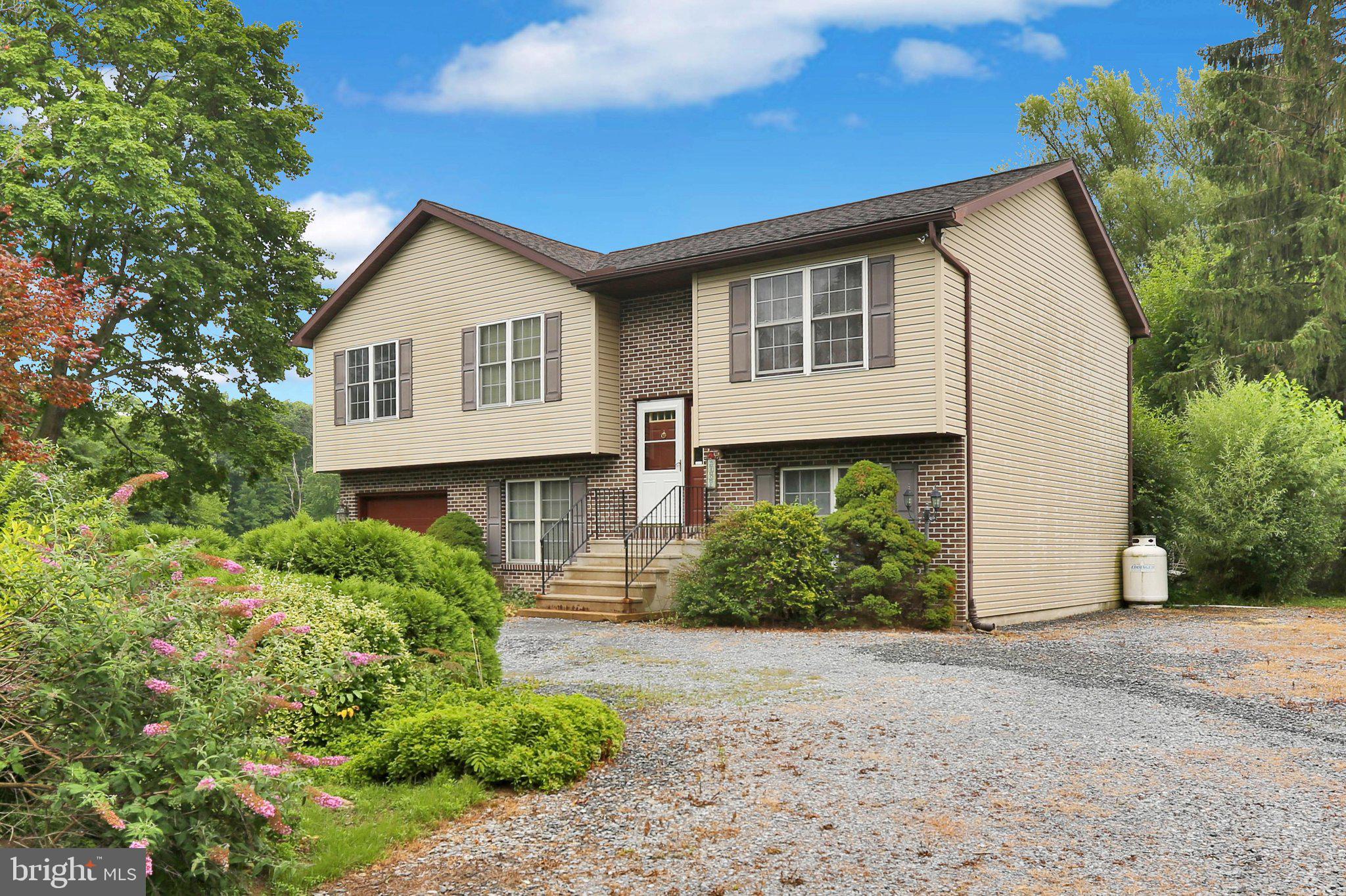 Tucked away on a peaceful, private lot, 246 Sandhill Rd offers the rare combination of privacy, nature, and opportunity. With virtually no through traffic, you'll enjoy a quiet setting where deer, birds, and other local wildlife are regular visitors, creating a relaxing retreat just minutes from everyday conveniences.

Inside, this spacious bi-level has fantastic bones, and all of the major mechanical systems have been well maintained over the years, providing a solid foundation for your updates. The home is looking for a fresh start with new paint and flooring, offering the perfect chance to customize the space to your own style. Outside, the grounds are ready for a refresh and offer plenty of potential to become a beautiful outdoor oasis.

Whether you're looking to build instant equity, invest in a home with tremendous potential, or simply want a peaceful property where you can create your dream home, 246 Sandhill Rd is a rare opportunity. If you've been searching for privacy, a beautiful natural setting, and a home that's ready for your personal touch, this is one you won't want to miss.