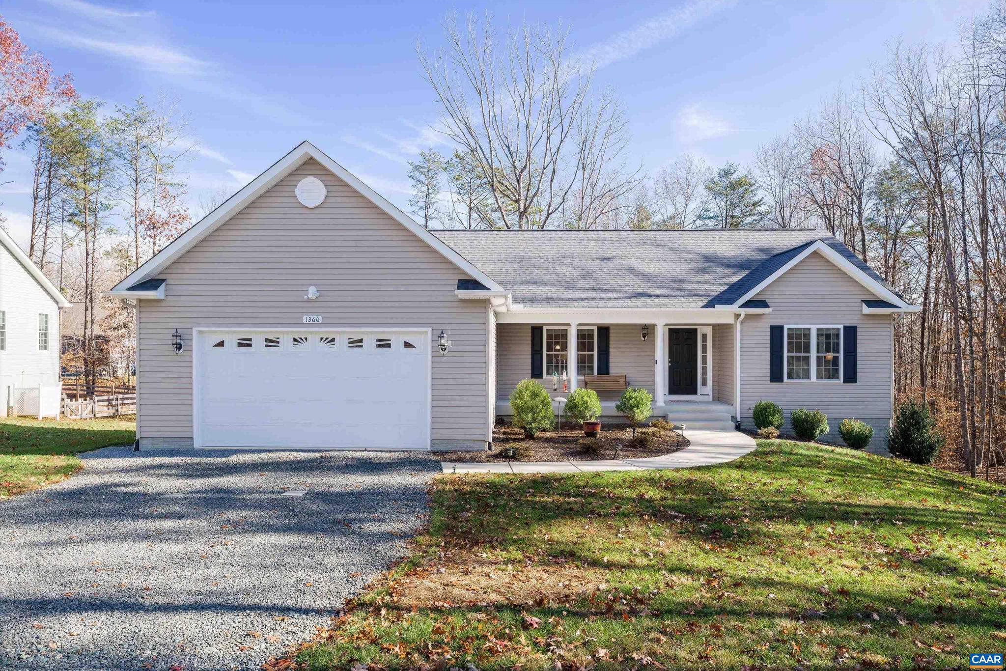 Welcome to 1360 Shenandoah Crossing!  Built in 2020 by Walt's Construction, this 3 bedroom, 2 bathroom ranch home with an attached 2 car garage and unfinished walkout basement is move in ready!  Spilt bedroom design with an open floor plan.  Tons of natural light.  Granite countertops, large island, and stainless steel kitchen appliances in the kitchen.  Large composite back deck is perfect for entertaining family and friends. Owners suite features trey ceilings, a walk-in closet, double vanity in the owners bathroom and large walk-in shower.   Unfinished basement is already rough in for a full bathroom and sliding back door leading out to the backyard.  Enjoy everything this community has to offer and feel like you are on vacation year around!,White Cabinets