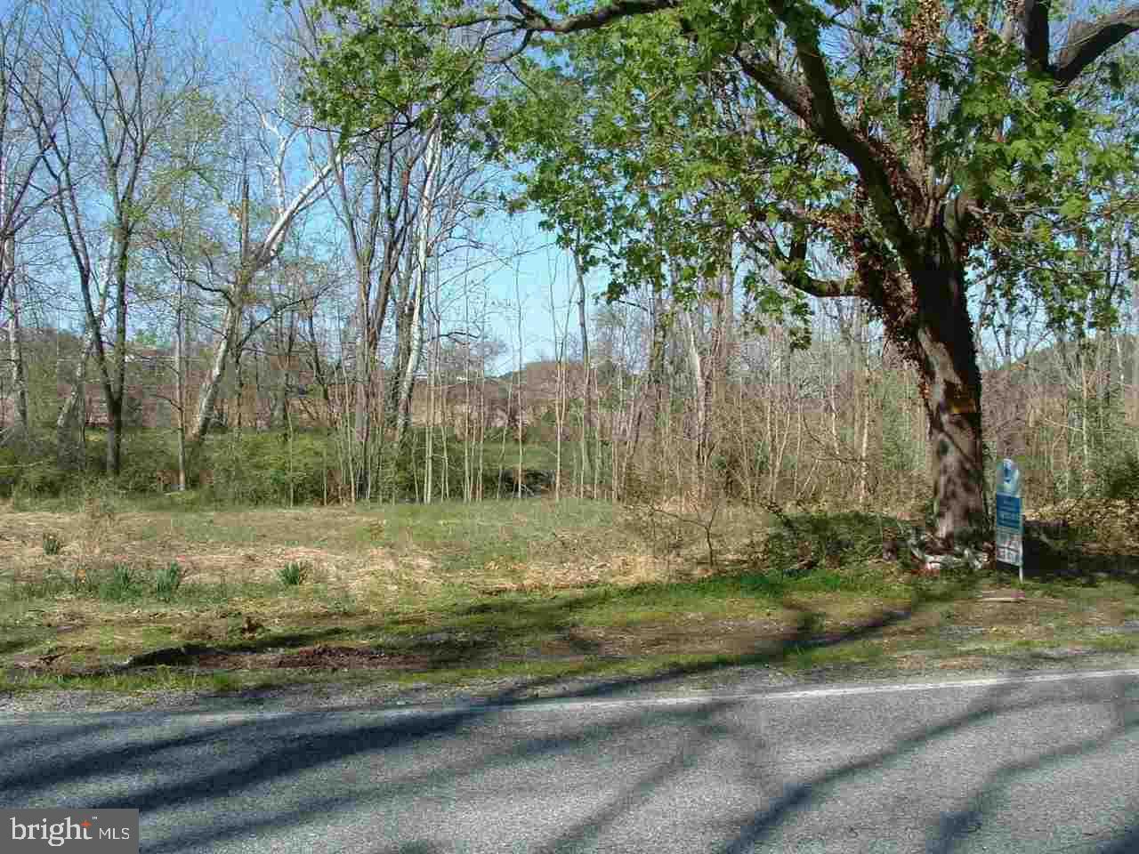 Nice building lot; level and cleared; stream in rear & side of property with land on both sides of stream.  Pre-existing well located towards front of property.  Very scenic setting.