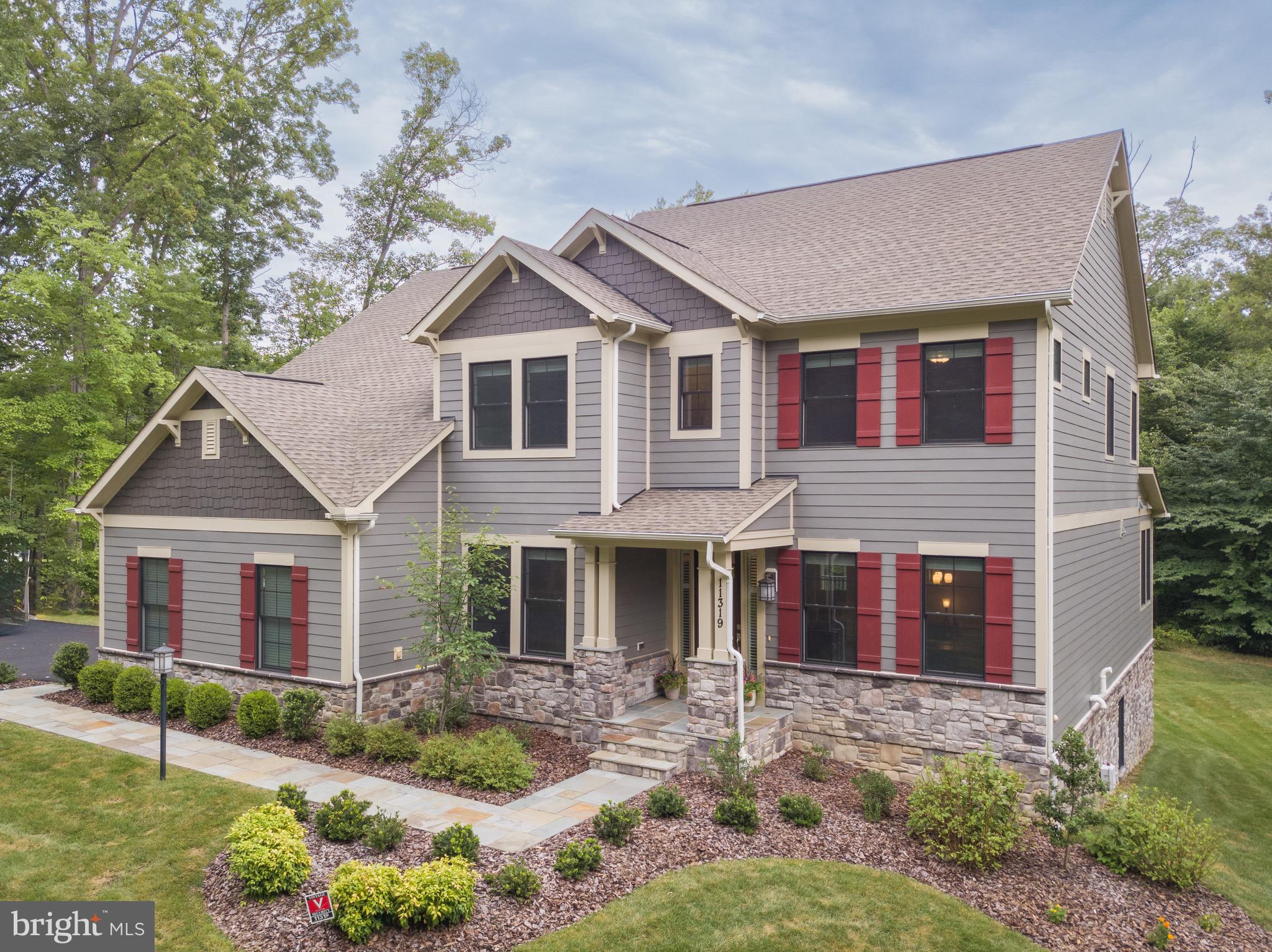 Welcome home to true multi-generational living in the heart of Fairfax County with 5 acres of privacy and serenity.

Built in 2019 by Christopher Companies, this home features six bedrooms and five and one a half bathroom. Of the bedrooms, three are multi-generational living ensuites – one on the main floor with its own entrance and exit from the side door, another in the basement, also with its own entrance and exit from the rear patio of the home, and finally an ensuite on the upper level. Complete with two full kitchens, three laundry areas and an expanded parking pad in the driveway this home is move-in ready. 

This lovely home is also spacious – with just under 6,000 sf of finished living area. The property's main floor is adorned with stunning hardwoods throughout, complete with a gourmet kitchen that any culinary enthusiast would appreciate. The kitchen is open to the breakfast nook and family room. Also on this floor is a generously sized living room/sitting room/office with with a view of woods and french doors, a spacious dining room, mudroom with a laundry area and side entrance. One of the most significant features of this floor is the main level ensuite complete with large primary bath, shower, tub, two vanities, water closet and unique walk-in-closet layout that doubles and a private entrance and exit for the suite.

The upper level is home of the second primary ensuite with a generously sized bathroom including oversized shower, dual vanities, water closet and walk in closet. Across the hall are two bedrooms, both with new carpet and a full hall bath. Rounding out the upper level is a full-sized laundry room and a bedroom ensuite currently being used as an office (also with new carpet). 

A second kitchen in the basement adds to the functional diversity of this home, making entertaining or shared living situations a breeze. The full kitchen is adjacent to the third primary ensuite. Also in the basement is the large recreation room, den, two additional finished spaces (think movie theatre room or fitness space) and over 400sf of unfinished storage space (with a third space for laundry!).

Stepping outside, a covered loggia on the main level and flagstone patio with a stone fire pit await, offering perfect spots in the large, green backyard, ideal for peaceful relaxation or social gatherings. The sidewalks to the front door and back door are covered in flagstone elevating the aesthetic of the overall property. These outdoor spaces invite you to enjoy the serene surroundings of the private, wooded landscape.

Situated in the heart of Fairfax, this property provides easy access to a range of local amenities. From shopping and dining options to outdoor recreational activities, there is something for everyone in this welcoming community. The property is also conveniently located to major transportation routes.

11319 Bellmont Dr combines the best of spacious, comfortable living with the peace and privacy of a woodland retreat. This property is a true gem, ready to become the perfect home for any potential buyer.