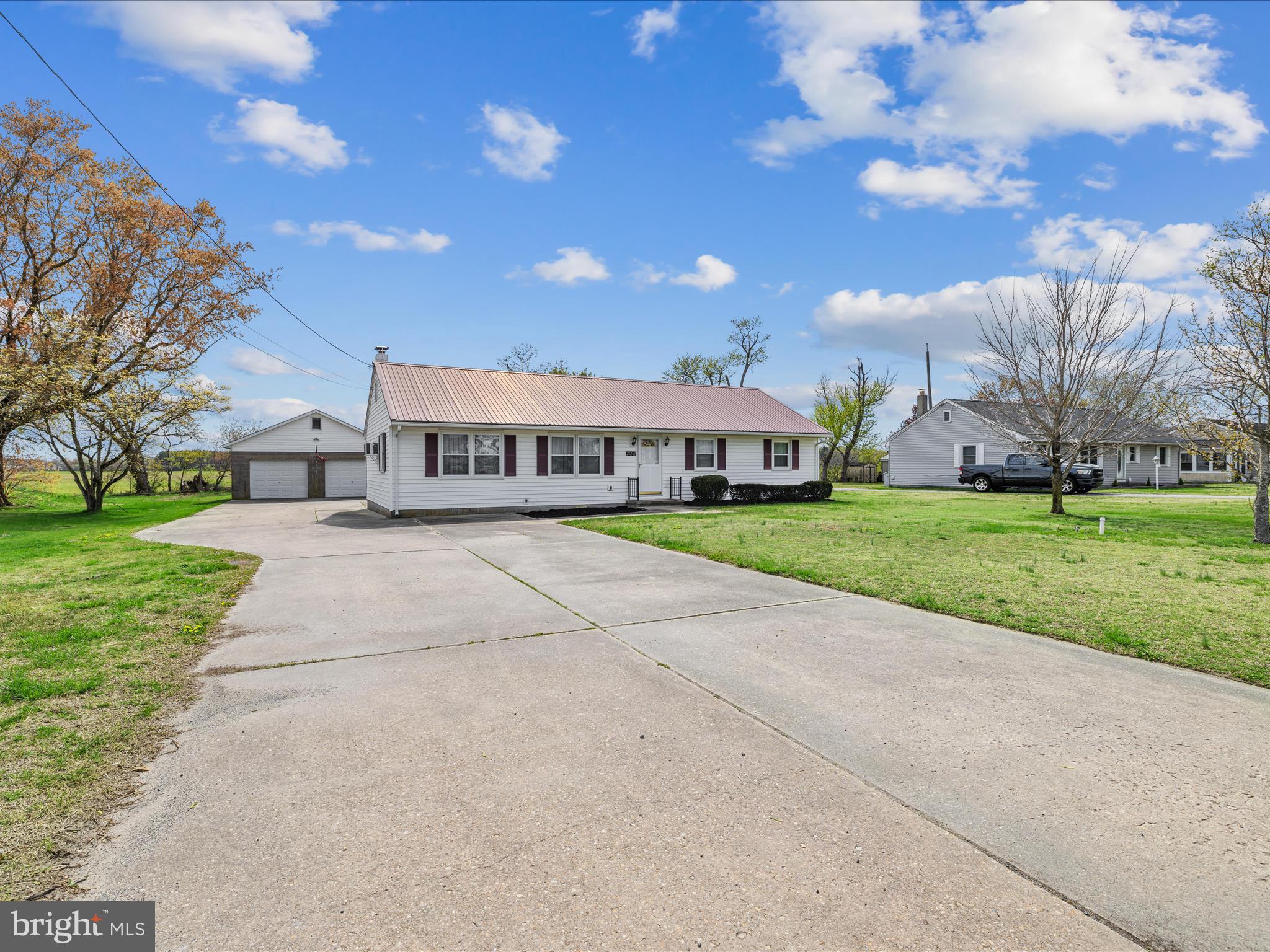 This charming 3-bedroom, 2-bath home is filled with years of love and cherished memories—now it’s ready for someone new to bring it back to life. While it needs some updates, it offers incredible potential with original hardwood floors tucked beneath the carpet and sits on a spacious half-acre lot in a desirable, central location. Enjoy peaceful mornings and relaxing evenings on the quiet screened-in porch off the back—perfect for sipping coffee, unwinding with a book, or entertaining guests. A sturdy two-car block garage is ideal for a workshop or the ultimate man cave. Centrally located just minutes from shopping, restaurants, and schools, this property offers both convenience and opportunity. Homes in this area are selling fast, and with this much potential, this one won’t last long. Being sold as-is and priced to sell—come take a look and imagine the possibilities!