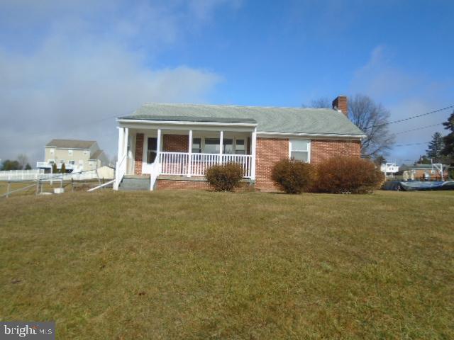 Nice size Rancher on huge .69 acres lot. Over sized detached garage in rear with work shop area and 1 car attached garage. Open floor plan on main level has 2/3  bedrooms and full bath. Walk up stairs to floored attic for added storage.  Eat-in kitchen has lots of cabinet space. Full basement has entrance to garage , bath and plenty of storage room. Walk out level to side entrance. Covered front porch. Close to shopping , restaurants & downtown Hampstead . Easy access to 30 bypass and 795. Agents please see agent remarks and documents on this listing for all contract details.  OPENS TO INVESTORS 2.22