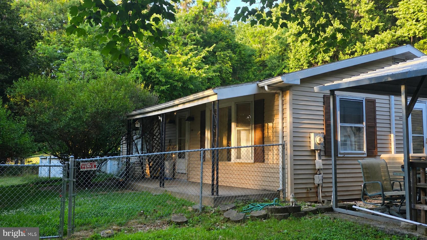 Situated on 8.7 acres near historic Sharpsburg and Antietam National Battlefield, this property offers 2 bedrooms, 1 full bath, and an unfinished basement. Surrounded by wooded acreage, the setting provides privacy and space to enjoy the outdoors.

The detached 2-car garage with electric, 2-car carport, and pole barn with electric offer additional storage, workspace, parking, or equipment storage options. The front yard is fully fenced.

Located in Washington County's Antietam region, the property provides convenient access to Sharpsburg, Antietam National Battlefield, outdoor recreation, shopping, dining, and commuter routes.