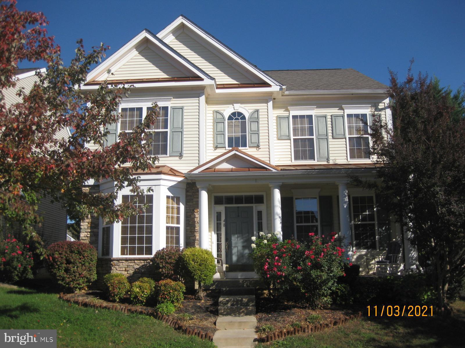 This spacious home features an open floor plan and has been professionally cleaned and the upstairs carpets have been freshly steamed cleaned. The property requires a credit score of 620 or higher and a minimum monthly income of $7,500. The home boasts a large, dream kitchen with ample cabinet and counter space, a pantry, and a kitchen bar overlooking a large family room with a fireplace. Formal dining and living rooms are available for entertaining guests. Upstairs, you will find four bedrooms and two bathrooms. Bedrooms two and three feature walk-in closets, and the beautiful owner's suite, also with walk-in closets, includes a garden tub, shower, and a large dual vanity. The property includes a detached two-car garage and an unfinished basement for storage. This is an excellent opportunity to reside in one of the most desirable areas of Charles Town, WV.