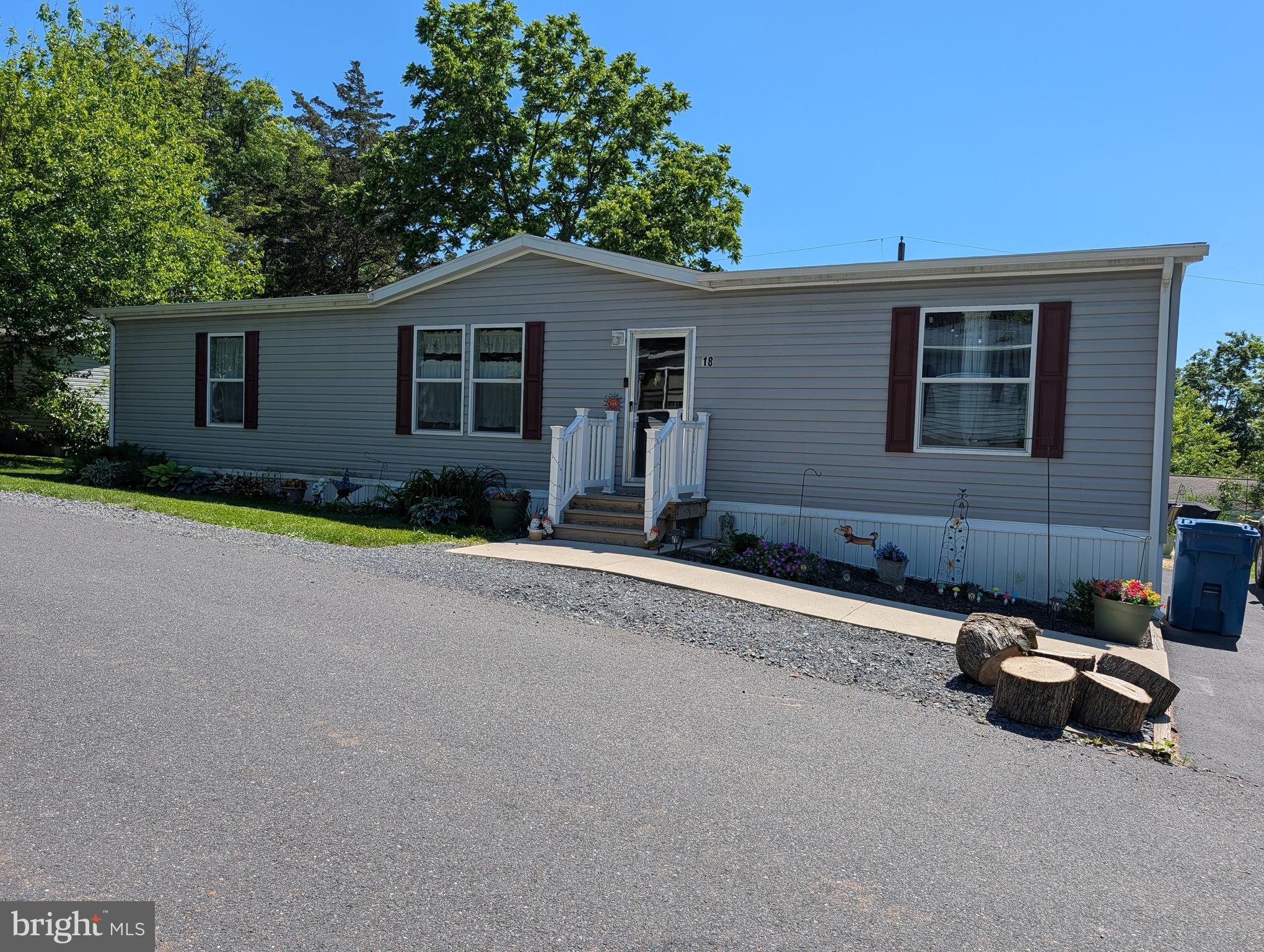 Welcome to easy, low-maintenance living in the desirable Melody Lakes community! This like-new manufactured home, built in 2023, offers modern open-concept living with stylish finishes throughout. The bright and spacious floor plan features a well-appointed kitchen with a breakfast bar that flows seamlessly into the living and dining areas, making it perfect for everyday living and entertaining. The primary suite includes a private ensuite bath for added comfort and convenience.

Outside, you'll find an 8' x 10' storage shed providing plenty of room for tools, outdoor equipment, and seasonal items.

The monthly land lease fee includes access to an impressive array of community amenities, including a swimming pool, mini golf course, chip-and-putt area, fishing ponds, community hall available for private functions, and scenic walking and biking trails. Enjoy an active lifestyle and resort-style amenities while living in a beautiful, move-in-ready home.