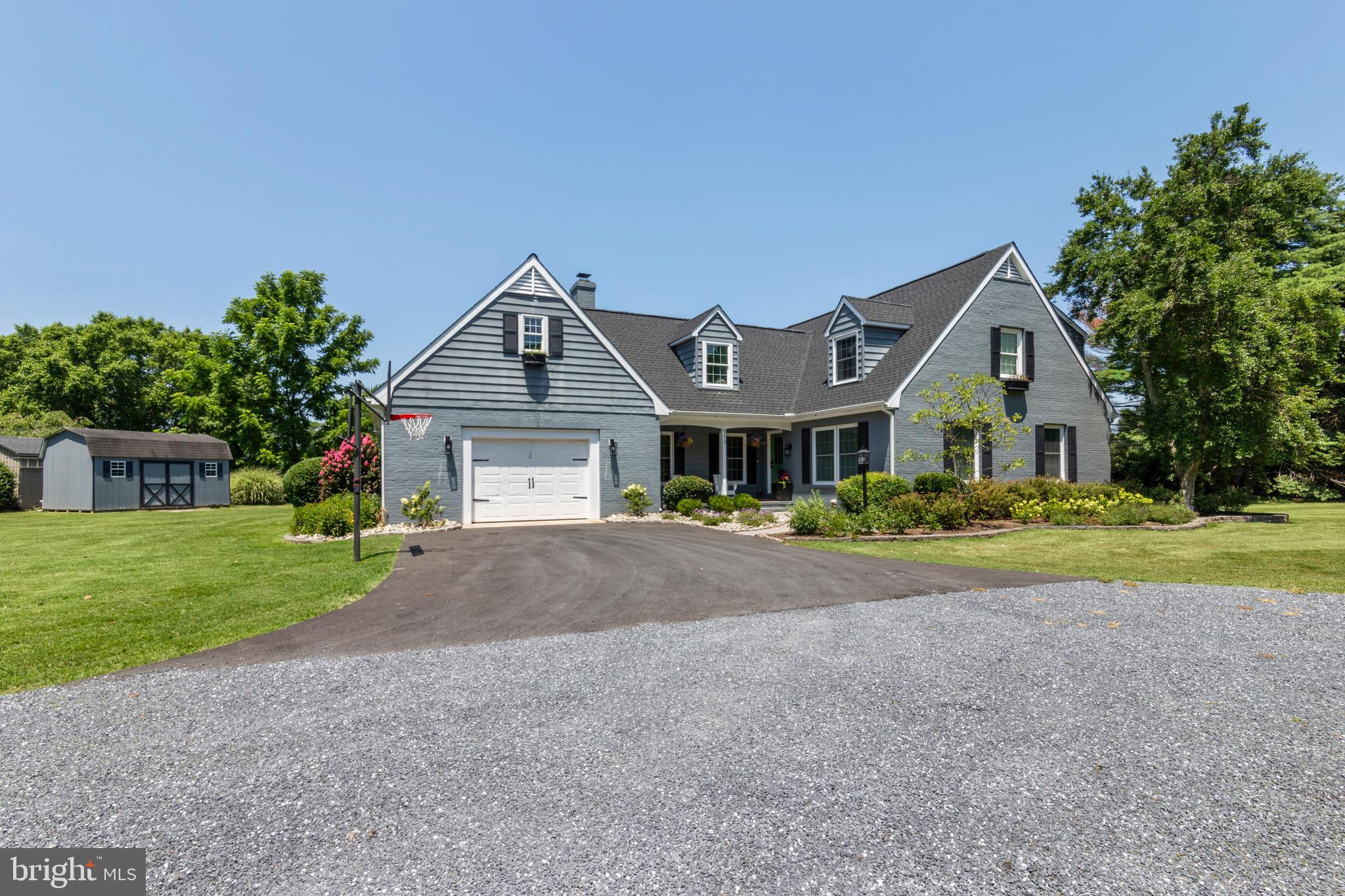 Charming 4 bedroom, 3.5-bath Cape Cod set on a parklike 2.4± acre lot overlooking the Talbot Country Club golf course. This home has seen recent updates including new roof, all new interior and exterior lighting, interior paint along with front of house, and paved parking. Featuring an updated kitchen with large marble center island with bar seating and stainless steel appliances. The living room offers floor to ceiling built-ins and a wood burning fireplace adjoining to a bright sunroom with vaulted ceiling. The first-floor primary suite offers a newly renovated bath with soaking tub, heated floors, and steam shower, while the second-floor primary includes a walk-in closet and private bath. A finished room above the garage provides ideal bonus space for an office, media room, or playroom. The property also includes a large yard with invisible fence, patio, shed for storage, and attached garage all within close proximity to downtown Easton.