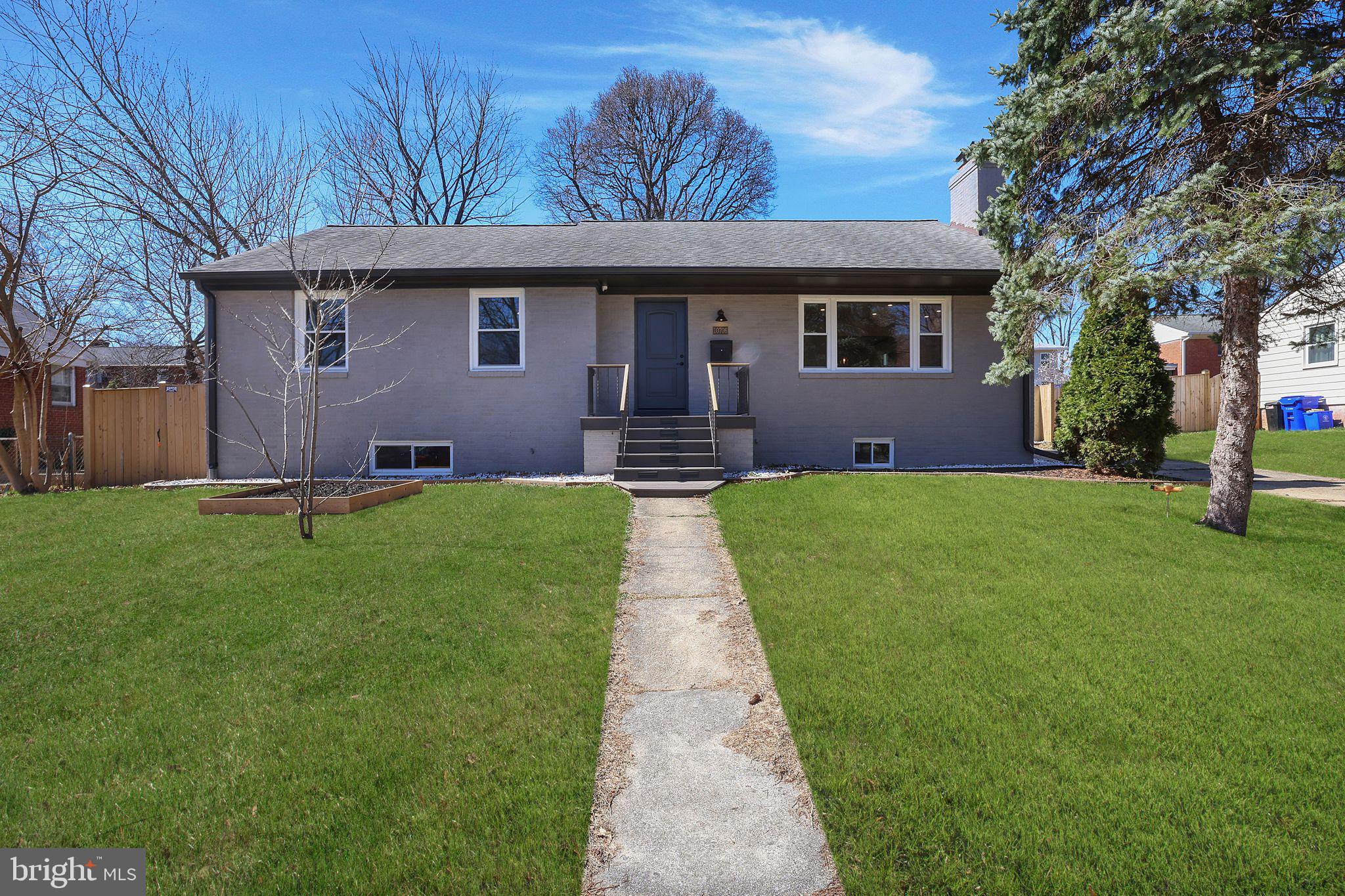 Welcome to 10706 Glenhaven Dr, Silver Spring, MD 20902 — a beautifully renovated rambler on a nearly 10,000 sq. ft. lot, ideally located close to both Wheaton and Forest Glen Metro stations. Thoughtfully redesigned in 2022 with no detail overlooked, this stunning home offers approximately 2,800 sq. ft. of finished living space (1,458 sq. ft. above grade and 1,300 sq. ft. below grade), featuring 3 bedrooms and 3 bathrooms.

The main level showcases a custom-designed gourmet kitchen with premium GE Café and Bosch appliances, flowing into an open dining and living area with a working Carrara marble fireplace. The master suite includes a custom-made walk-in closet and a spa-like master bathroom. A guest bedroom and guest bathroom complete this level. The new oak flooring throughout is complemented by porcelain tiles in the bathrooms and entryway.

The fully finished basement offers 9-foot ceilings and includes a spacious living room with a working fireplace, a dining area, a recreation room with a wet bar (featuring a new dishwasher and refrigerator), a remodeled bathroom, a guest bedroom, and a laundry room with a new GE washer and dryer. The basement also benefits from porcelain flooring and a comprehensive waterproofing system with two new sump pumps, radon mitigation, wall insulation, and a Bosch double-zoning furnace and AC unit for energy efficiency.

All appliances and lighting are energy-saving and programmable. The three bathrooms feature Panasonic fans with automatic humidity sensors to prevent moisture build-up and mold. Additional upgrades include new energy-efficient double-glass windows, interior and exterior doors, and integrated audio systems with ceiling speakers on both levels.

The exterior is just as impressive, featuring a beautifully landscaped front and backyard, a new hot tub, a 607 sq. ft. wood deck, a 136 sq. ft. covered porch, and a screened-in porch. The chimney lines and gutters have also been replaced. Stairs off the dining area lead to a large unfinished attic, offering the potential for additional finished space or ample storage.

This is a rare opportunity to own a thoughtfully upgraded home on an oversized lot in a prime Silver Spring location!