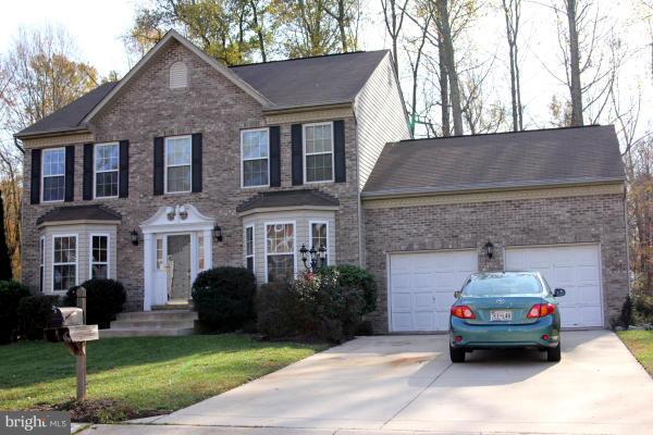 Luxurious home with large master suite.Quiet court, fenced backyard  backs to woods and small stream. Wood floor in kitchen, eating area, and foyer. Kitchen is open to family room with gas fireplace. Kitchen has built-in microwave, large side-by-side fridge, island. Captivating design includes several bay windows.  Painting in progress with neutral color. Landscaped nicely.