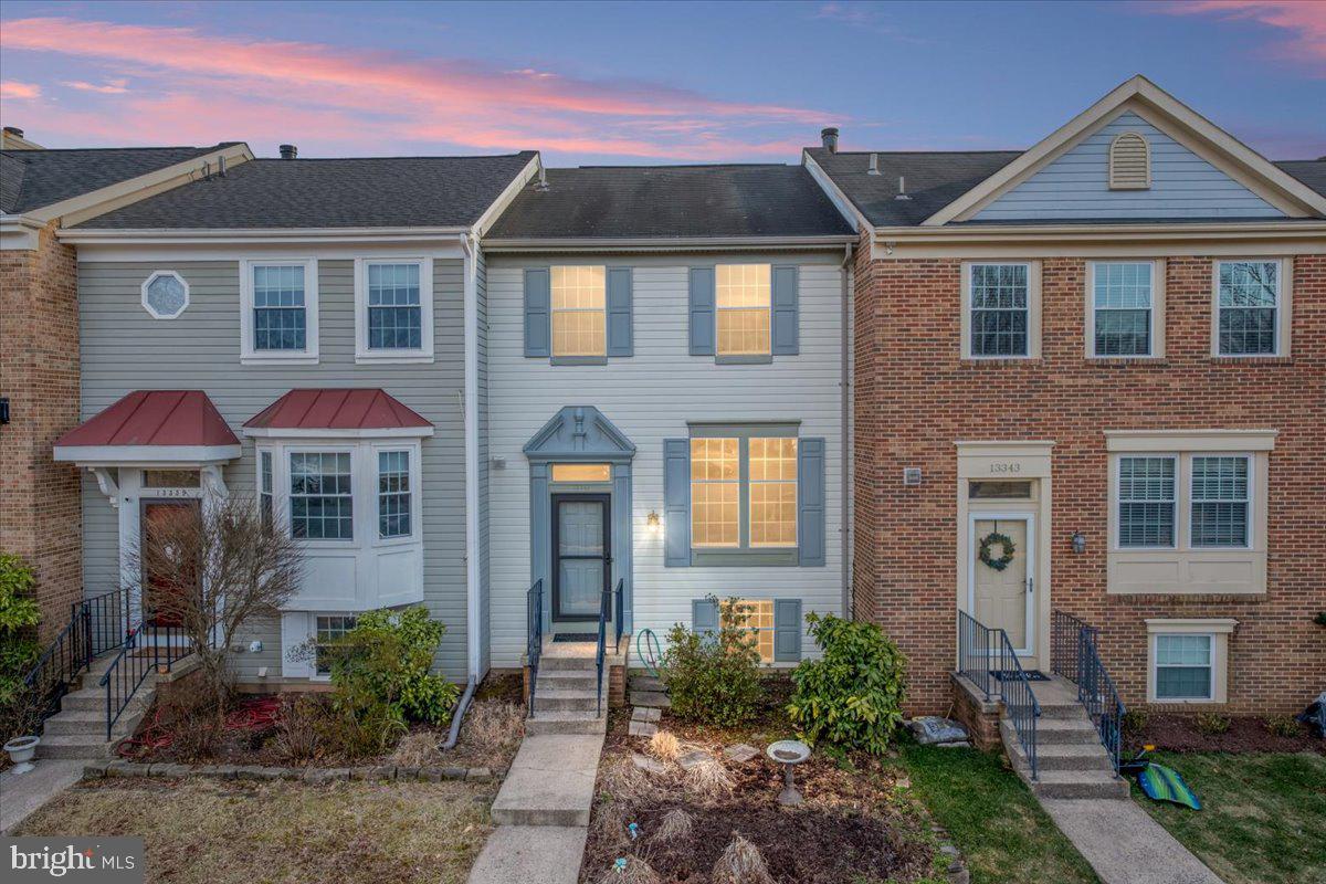 Welcome home to this beautifully maintained 3-bedroom, 3.5-bathroom townhome, offering three finished levels of stylish and comfortable living space! Nestled in a desirable community, this home backs to lush common space, providing scenic views from the large deck and easy access to amenities including tennis courts, tot lots & a pool. Perfect for recreation and relaxation! Inside, you'll love the modern kitchen with new stainless steel appliances,  sleek quartz countertops, ample cabinetry, and a functional layout designed for both cooking and entertaining. The spacious living and dining areas feature abundant natural light, creating a warm and inviting atmosphere. Upstairs you'll find 2 primary bedroom suites, both with private en-suite baths. The fully finished walk out basement provides a 3rd bedroom or would also be ideal as a recreation room or home office complete with another full bath & wet bar.  Fabulous fenced back yard with gate to walk out to open common space.  Enjoy the convenience of two reserved parking spaces, plus nearby visitor spaces.  Prime location near shopping, dining, and major thoroughfares!  Buyer's Financing fell through, creating opportunity for you!