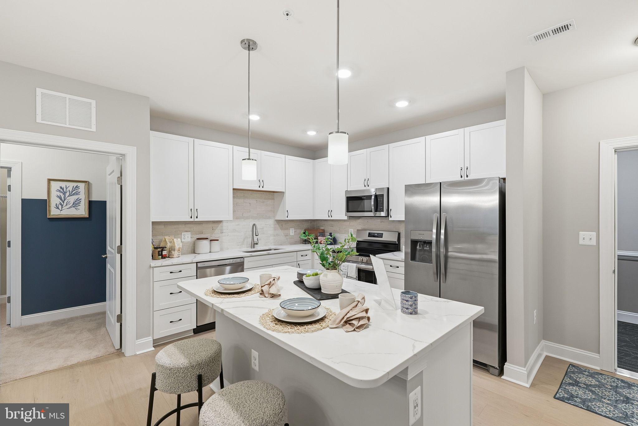 PRICE IMPROVEMENT ON THIS QUICK MOVE IN- This AMAZING home is loaded with upgraded features and  sales price is less than a New Build - DONT MISS OUT!!

Luxury Elevator condominium complete with a private 1-car garage.  The Bel Air offers 2 spacious bedrooms, each with a walk-in closet and 2 full baths with the added bonus of a powder room. The kitchen comes with stainless steel appliances and opens to a spacious living/dining room area that has access to your private balcony. The finishes in the home are stunning.  A spacious laundry room   and pantry allow for plenty of storage.  Blinds are also included. 

$10,000 Toward closing costs with use of Preferred Lender and Title Companies

The amazing home is Move-In Ready!!   1445 sq. ft. of amazing living space. 

Sales Center is located at 404 Bold Ruler Model and Sales Center open Friday-Tuesday 11-5.