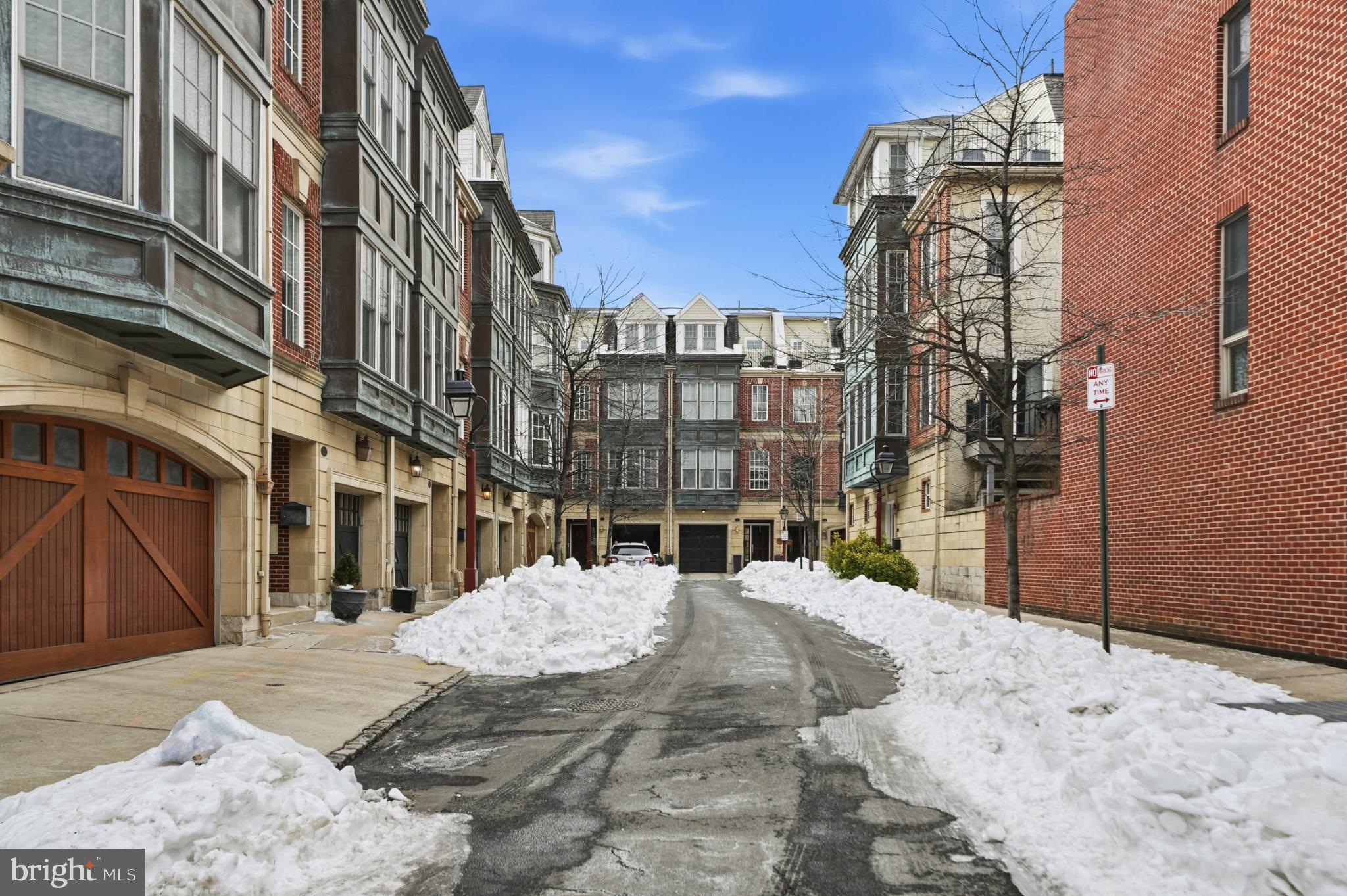 A GEM WITH PARKING in Society Hill.  Experience the epitome of refined city living in this stunning contemporary townhouse, meticulously redesigned between 2016–2018 to deliver an exceptional lifestyle that seamlessly blends elegance, comfort, and modern functionality. Offering approximately 2,720 square feet of thoughtfully curated living space, this residence is a true sanctuary for those who appreciate sophisticated design and high-end finishes. The entry level welcomes you with a gracious foyer leading to a versatile TV or media room with custom built-ins, direct access to the private patio, and an attached garage. A conveniently located powder room completes this level. Ascending to the main living floor, you’re greeted by a light-filled, open-concept layout where transitional architectural elements meet contemporary style. The living, dining, and kitchen areas flow effortlessly, creating an inviting atmosphere ideal for both entertaining and everyday living. At the heart of the home is the gourmet kitchen, featuring top-of-the-line appliances, sleek cabinetry, and luxurious countertops—designed to inspire culinary creativity while remaining highly functional. Whether hosting an intimate dinner or enjoying a casual morning at home, this space delivers both style and substance. The upper levels offer exceptional flexibility and privacy. Two spacious bedroom suites provide serene retreats, each with spa-inspired bathrooms appointed with premium fixtures and finishes. The top floor features two additional bedrooms or office spaces, along with a balcony offering a rare city view—perfect for enjoying New Year’s Eve fireworks over the Delaware River. Outdoor living is thoughtfully incorporated throughout the home, with a private patio on the first level and balconies on both the second and fourth floors—ideal spaces for unwinding. Every detail of this residence has been carefully considered to ensure comfort, sophistication, and ease of living. Perfectly positioned in a peaceful yet vibrant neighborhood, this home offers convenient access to Head House Square, the Park at Penn’s Landing, shopping along South and 4th Streets, and acclaimed dining destinations such as Zahav and Pizzeria Stella. This is more than a home—it’s a lifestyle. A rare opportunity to enjoy modern luxury, parking, and exceptional design in one of Philadelphia’s most sought-after locations.