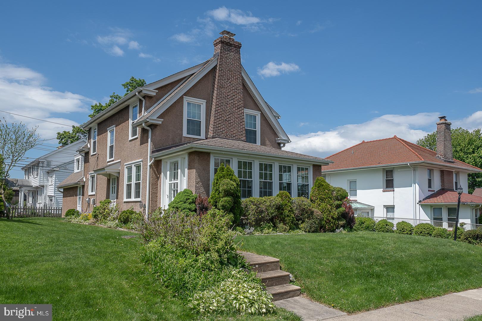 Welcome to 470 Gainsboro Rd , one of the most meticulously maintained homes in Drexel Park, where timeless character meets exceptional care. From the moment you arrive the property's outstanding curb appeal and lush, thoughtfully maintained landscaping make a memorable first impression. A private driveway guides you to the right side of the home, leading to the main entrance, a patio area, and an attached two car garage. The long driveway widens at the top, allowing parking for numerous vehicles in addition to garage space. On the left side of the house a few steps and a walkway lead to a separate entrance into the enclosed porch, direct access to the basement, and to the possible mother-in-law suite. The Main entrance opens into a welcoming foyer featuring beautiful hardwood floors that extend throughout the first floor living and dining rooms and continue up the main staircase. The spacious living room is filled with natural light and showcases a stone, wood-burning fireplace, built -in book shelves, a ceiling fan , and large windows, A doorway leads into a bright and cozy sunroom which is the ideal spot to relax and enjoy peaceful evenings. To the right of the foyer is a formal dining room enhanced by classic chair-rail trim, adding a touch of elegance. From there, the kitchen offers ample cabinet space, gas cooking, and room for a small dining table and chairs. Just beyond a pantry area, stairs lead down to a clean, unfinished basement that houses the laundry area and provides generous flexible space for storage, a workshop, or future customization. A hallway off of the kitchen leads you to a rear staircase that opens up to a private bedroom and a full bathroom located above the garage. This is the perfect space for guests, an in-law suite, or a home office and does connect to the main second floor level with two steps. From the main foyer elegant wood stairs lead you to the second floor where you'll find the large primary bedroom featuring hardwood floors , abundant natural light, and two sizable closets. There are two more bedrooms, equipped with ceiling fans, and a spacious full ceramic tile bathroom. The second floor hallway also includes access to a walk-up attic that offers generous storage space and the potential for future expansion. Additional highlights include newer replacement windows throughout, gas hot water heating, a gas hot water tank, and a 100-amp  circuit breaker electrical service. If you are looking for a home full of character, an abundance of charm, and thoughtful care, 470 Gainsboro Road may be the perfect fit!
 Schedule your private tour of this property today and experience it's appeal for yourself!