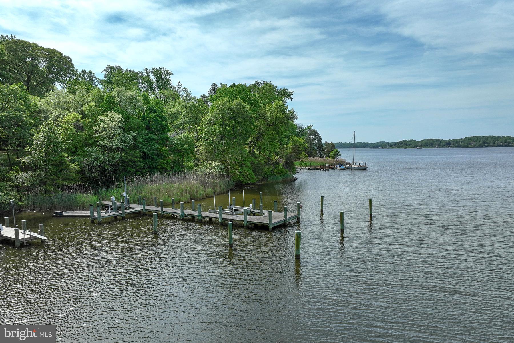 MAJOR PRICE ADJUSTMENT! Fabulous waterfront property on desirable Childs Point Road provides the perfect setting for your new dream home. It is a bucolic drive past estate homes to this very special location, close to the mouth of Church Creek. The owners have built an incredible dock complex with room for several power and/or sailboats. The complex includes 2 jet ski lifts, a 10,000 lb boat lift, and two large slips -- one of which could accommodate a 60 ft yacht. The water depth is 8 ft MLW and it’s a 12-minute ride to the mouth of the South River (where it meets the Bay). It's also fun to poke around the creeks on the South River, or tie up at a local crab house that is literally a five-minute ride by boat. With 178 ft of waterfrontage on Church Creek, 924 Childs Point has had a perc test for a 3500+ SF home and engineering showing a waterside pool. Spend a day on the Chesapeake Bay and come home to your luxurious new home. Close to town but in a very serene and private setting, this property will be the basis for years of waterfront enjoyment. Take the Tour on-line!