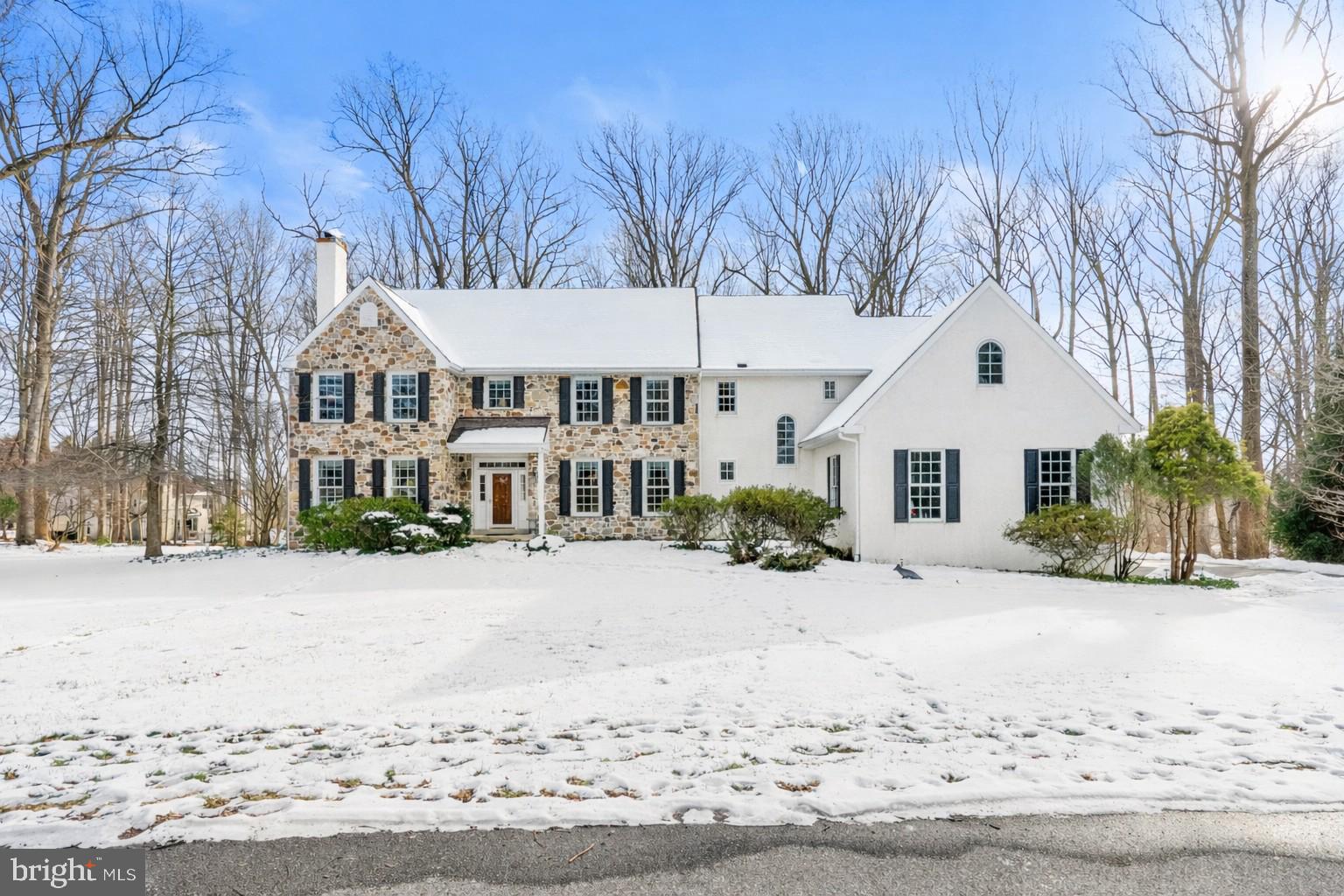 Just Listed | Custom-Built 5-Bedroom Stone-Front Home | West Chester Area School District.
Welcome to a truly charming, custom-built stone-front residence, perfectly situated on a flat 1.3 acre lot on a cul-de-sac street of just seven homes in one of West Chester’s most desirable neighborhoods. Located in the award-winning West Chester Area School District and served by Henderson High School, this home offers the rare combination of privacy, quality, and timeless design. Thoughtfully crafted by Perna Brothers, this approximately 5,000-square-foot traditional home features five full bedrooms and showcases exceptional craftsmanship, classic architecture, and enduring value throughout. A gracious front-to-back foyer sets the tone, flanked by a traditional living room with custom trim and a fireplace, opening through French doors to a private first-floor office with custom built-ins. Opposite the living room is a spacious formal dining room, enhanced by a substantial butler’s pantry and bar area complete with sink, wine refrigerator, dishwasher, and abundant cabinetry—an exceptional addition rarely found in today’s floor plans.
The gourmet kitchen offers stainless steel appliances, a Dacor range, custom cabinetry, and a large built-in hutch, flowing seamlessly into the breakfast room. Completing the first floor is the inviting family room with custom built-ins and a second fireplace, ideal for everyday living and entertaining alike. 
The second level features a luxurious primary suite with sitting room, large bathroom, and two walk-in closets. Four additional bedrooms include one private suite, while three others share a generously sized hall bath. The unfinished lower level boasts high ceilings and a slider to the rear yard, offering outstanding potential for future living space. Notable features include hardwood floors throughout the first floor, 1.5 bathrooms  on the main level, oversized closets, generous room proportions, and custom details at every turn. The welcoming layout, quality construction, and attention to detail reflect a level of craftsmanship that is increasingly hard to replicate at this price!
Ideally located close to the West Chester Borough, shopping, schools, and major roadways. Homes of this caliber, setting, and quality are seldom available.