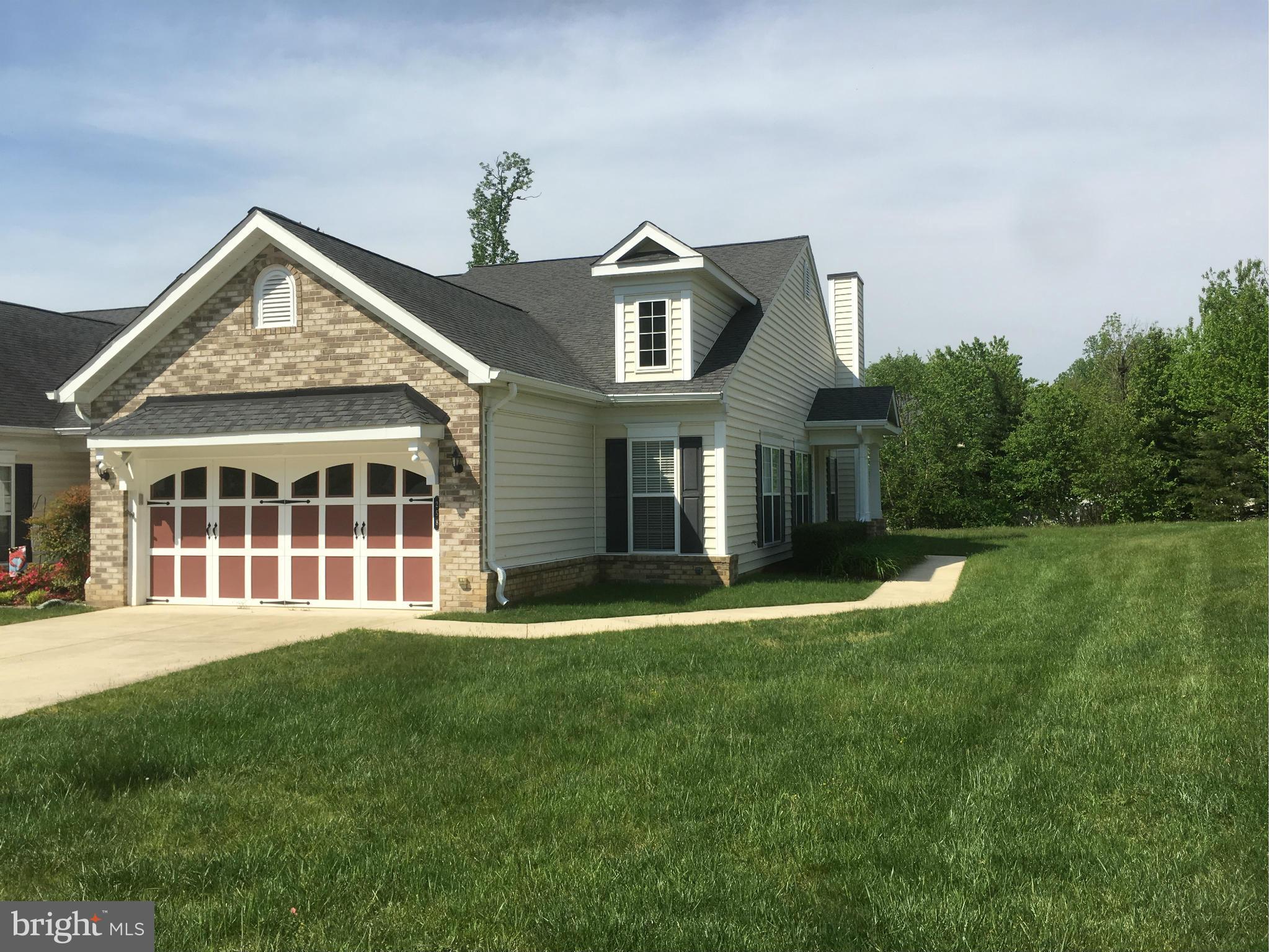 bargain in this over 55 community w/ club house & pool, convenient to shopping, dining, theater, library, hospital.  spacious end unit w/ cathedral ceiling, tray ceiling in master, walk in shower + full bath w/ tub in 2nd mstr, formal dining rm w/ wainscoting on walls, custom window treatments, side entry, doors to patio. HOA covers all of yard, mulching, pool, clubhouse, common areas.