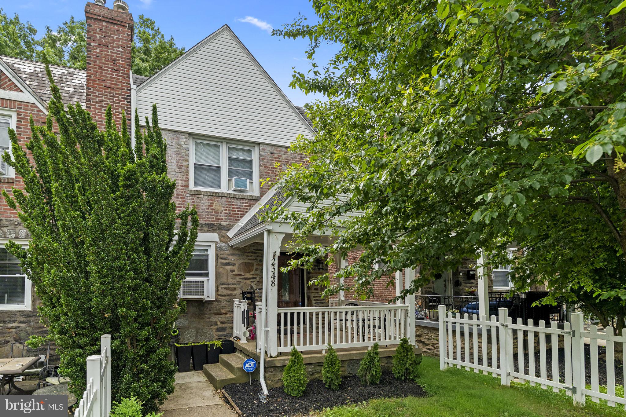 Now available in the desirable Drexel Hill Gardens neighborhood, this tucked-away end-unit brick townhome offers comfort, functionality, and inviting indoor-outdoor living. A beautifully maintained walkway and front yard lead to the covered front porch and into an open-concept first floor layout. Inside, you’ll find a convenient coat closet and a spacious kitchen featuring an island that overlooks the dining area, creating the perfect flow for everyday living and entertaining. Sliding glass doors extend the living space outdoors to a rear deck, ideal for relaxing or hosting guests while enjoying views of the expansive backyard. Upstairs, the home features three bedrooms and a full hall bathroom. The living space continues into the fully finished basement, complete with an additional full bathroom and a bonus room that works perfectly as a guest bedroom, home office, gym, or flexible living space. Laundry is also conveniently located on the lower level, along with access to the rear parking space beneath the deck. Conveniently located near State Road with easy access to local shopping, dining, and everyday amenities, this home combines charm, space, and practicality in a sought-after location.