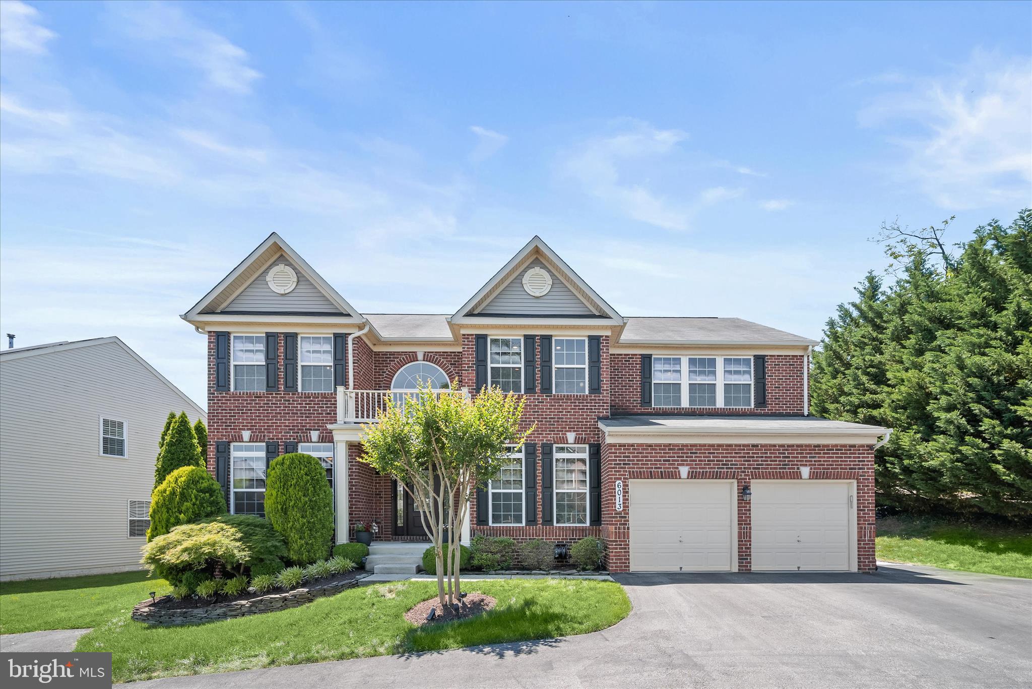 Nestled in the highly sought-after Hunters Ridge community, this exceptional Colonial has been meticulously maintained by its original owners and showcases a perfect blend of elegance, comfort, and modern updates. Sun-filled living spaces are enhanced by gorgeous hardwood flooring, new plush carpeting, freshly painted interiors, and a premium Sonos sound system throughout the home and outdoor living areas. The formal living room features crown molding and a ceiling fan, while the elegant dining room is beautifully appointed with crown molding and chair rail detailing, creating an ideal setting for entertaining. At the heart of the home, the stunning kitchen offers granite countertops, a center island with breakfast bar, pendant and recessed lighting, stainless steel appliances, decorative tile backsplash, and a spacious breakfast area. Andersen French doors (2021) provide seamless access to the expansive deck, where you can relax and enjoy tranquil tree-lined views overlooking the patio below.
Open to the kitchen, the inviting family room is perfect for gathering with family and friends, featuring a gas fireplace accented by stone surround and a ceiling fan. A private home office provides an ideal work-from-home space, while a powder room completes the main level. Upstairs, the luxurious primary suite offers a spacious sitting area, walk-in closet, and ceiling fan. The spa-inspired en suite bath features separate vanities, an oversized soaking tub, and a separate shower. Three additional generously sized bedrooms, a full hall bath, and a convenient laundry room complete the upper level. Designed for both recreation and relaxation, the finished lower level boasts a large recreation room, game room, exercise room, wet bar, and a state-of-the-art home theater, creating the ultimate entertainment destination. Significant updates completed between 2021 and 2026 include interior painting, new carpeting, water heater, Pella front entry door, Andersen French doors, and refrigerator, offering peace of mind for years to come. Ideally located near major commuter routes, shopping, dining, and everyday conveniences, this remarkable home truly has it all. Simply perfect!