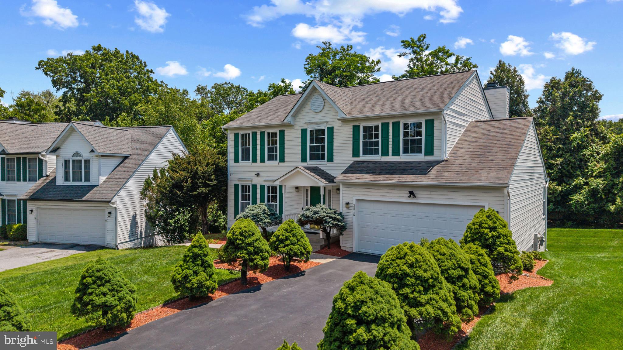 Beautifully maintained Colonial residence offering 4 bedrooms, 3 full bathrooms, 1 half bathroom, 3,032 finished square feet, and a 2-car garage, nestled at the end of a tree-lined driveway on a cul-de-sac in desirable Westgate. // Step inside the inviting traditional floor plan where hardwood floors span the main level, beginning in the welcoming foyer with a convenient powder room and laundry room. To the left, the sun-filled formal living room is framed by oversized windows and flows seamlessly into the elegant formal dining room, enhanced by a chair railing and a classic chandelier for effortless entertaining. // The beautifully updated eat-in kitchen, renovated in 2016, features quartz countertops, stainless steel appliances, ceramic tile flooring, a pantry, decorative tile backsplash, and abundant cabinetry. An inviting breakfast room is complemented by custom built-ins with additional cabinetry and open shelving, along with sliding glass door access to the deck. Open to the breakfast area, the spacious family room is centered around a cozy wood-burning fireplace, creating the perfect gathering place. // Hardwood floors continue throughout the upper level, where the expansive owner's suite offers soaring cathedral ceilings, a walk-in closet with a custom organization system, and a beautifully renovated ensuite bath (2017) featuring a quartz-topped dual-sink vanity, air-jetted soaking tub, frameless glass shower with designer tile and a rainfall showerhead, and a private water closet. Three additional bedrooms and a full bathroom updated with modern finishes (2017) complete the upper level. // The walk-out lower level provides exceptional flexibility with a spacious recreation room featuring engineered hardwood flooring, built-in shelving, and a dry breakfast bar area with mirrored wall accents. A versatile bonus room offers the perfect space for a home office, guest room, fitness area, or hobby room. An updated full bathroom (2019) and a workshop or storage room complete this level. // Outdoor living is equally inviting with a spacious deck featuring a retractable awning, perfect for relaxing or entertaining while overlooking the large backyard that backs to mature woods for added privacy. A storage shed beneath the deck provides additional storage, while a concrete pathway conveniently connects the walk-out lower level to the front yard. // Additional improvements include the roof, HVAC system, and water heater, all updated in 2018 for added peace of mind. // Select photos have been virtually staged for illustrative purposes only.
 Select images have been virtually staged for illustrative purposes.
