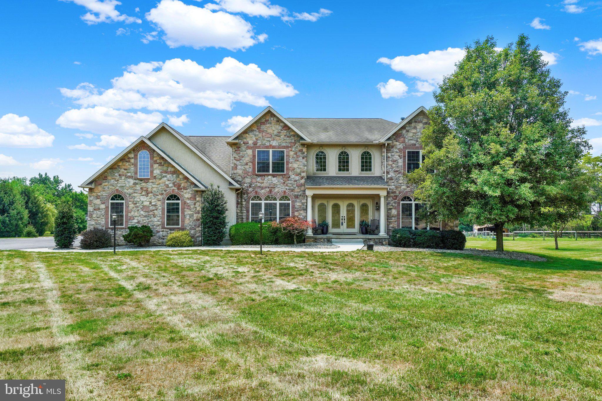 Welcome to 104 Monument Drive, a beautifully updated custom home offering the perfect blend of open living space, indoor comfort, and outdoor enjoyment on 4.67 scenic acres. The main level features an inviting open floor plan with spacious gathering areas, updated finishes, and a natural flow that works well for both everyday living and entertaining. With 5 bedrooms and 4 full baths, the home offers excellent flexibility for guests, work-from-home space, hobbies, or additional private living areas.

The finished lower level expands the home in a big way, providing generous additional living and recreation space with room for entertaining, relaxing, games, media, fitness, or multi-purpose use. Outside, the property continues to impress with a beautiful in-ground heated pool, expansive decking, and multiple outdoor entertaining spaces designed to enjoy the private setting. The acreage includes mature apple, cherry, and peach trees, adding charm and seasonal enjoyment to the property. With its updated interior, spacious layout, finished lower level, pool area, and estate-style lot, this property offers a rare opportunity in the Elizabethtown market.