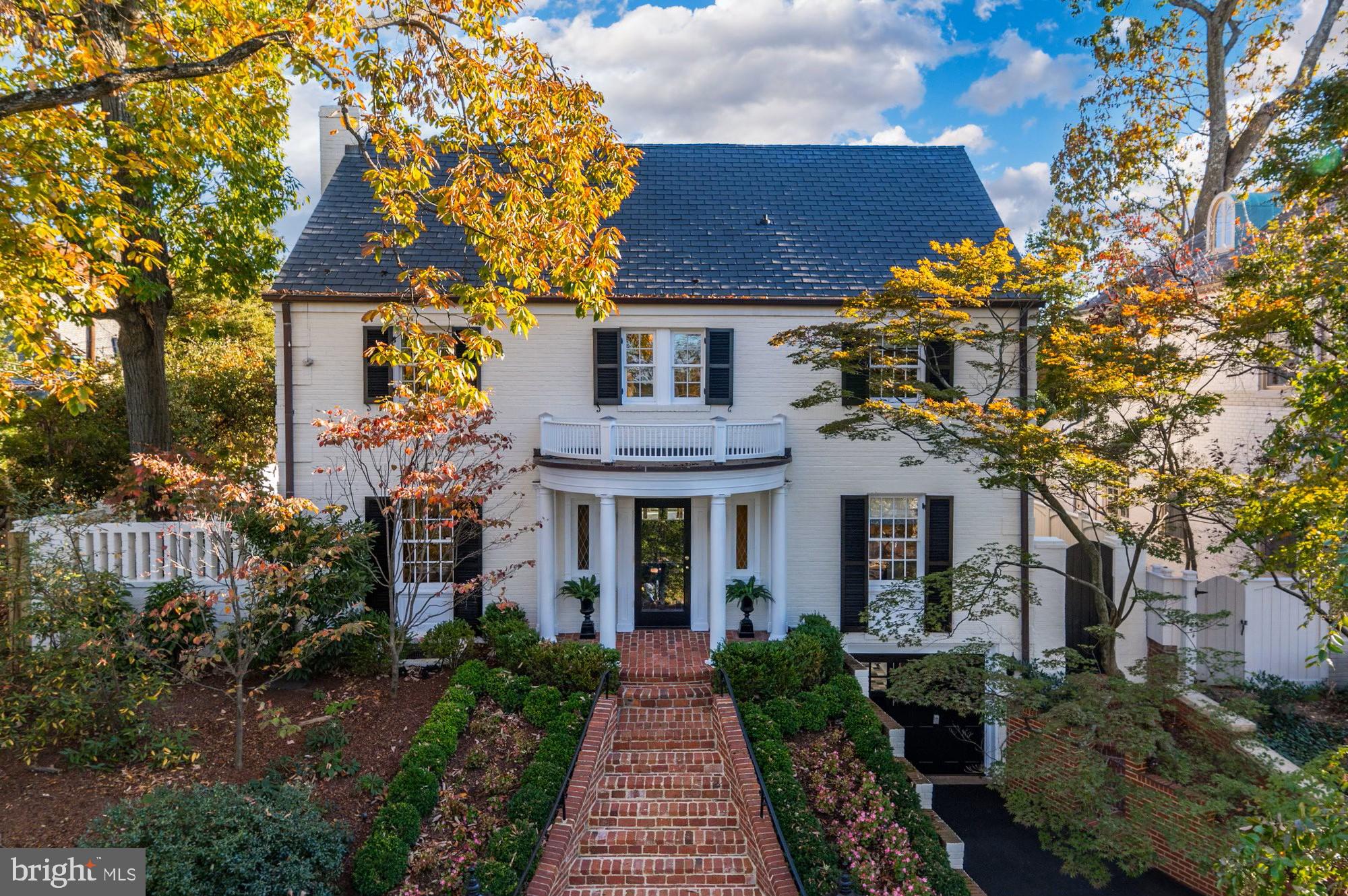 Ideally situated in the coveted Kent neighborhood, this stunning brick colonial is set back and elevated from the street, showcasing the perfect blend of classic traditional elements and a spacious floor plan for modern living. The home is positioned on a private lot with a circular driveway and a front-loading garage, providing additional parking on Chain Bridge Road at the rear entrance. Spanning nearly 4,500 square feet of welcoming interior space, this residence boasts 5 bedrooms, 2 home offices, and 4.5 bathrooms. The large main level, designed for entertaining, features sun-drenched rooms, a grand foyer, hardwood floors, and exquisite details throughout. Meticulously maintained and lovingly updated, this home offers numerous upgrades, including a two-zone HVAC system, a partially new roof in 2023, a new rear fence, and beautiful landscaping. Residents in this highly sought-after neighborhood are just steps away from Battery Kemble Park and nearby shopping and amenities in Spring Valley, Wesley Heights, and the Palisades. Additionally, the home is conveniently situated near notable cultural landmarks across the Capital region, major commuter routes, and Sibley Hospital.