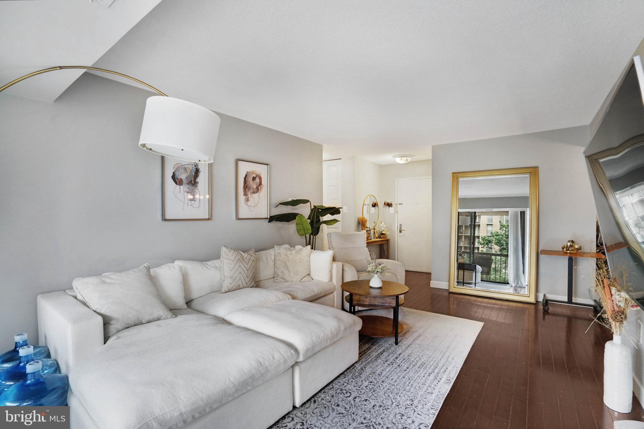 Imagine calling this luxurious 2-bedroom, 2-bathroom home your very own. Nestled on the 4th floor, this stunning unit boasts a private balcony with serene treetop views of the outer common area. As you enter, you're welcomed into the elegant living room and dining area, both seamlessly guiding you into a gourmet kitchen adorned with sleek stainless steel appliances and abundant cabinet space. Picture hosting guests in a setting that flows with such effortless grace. The sophisticated primary bedroom offers a spacious walk-in closet and access to the refined en-suite bathroom. Enjoy the convenience of in-unit washer and dryer hookups, enhancing your daily living experience. Expansive windows throughout the home invite ample natural light, creating a bright and airy atmosphere. Situated just a block away from the vibrant Columbia Pike, this Arlington residence promises a lifestyle of unparalleled convenience and elegance. For further details, contact the Co-Listing Agent, Blake Hardesty. VIDEO TOUR: https://homes.btwimages.com/vd/214492431 3D TOUR:https://my.matterport.com/show/?m=r7ouy9qyNZk